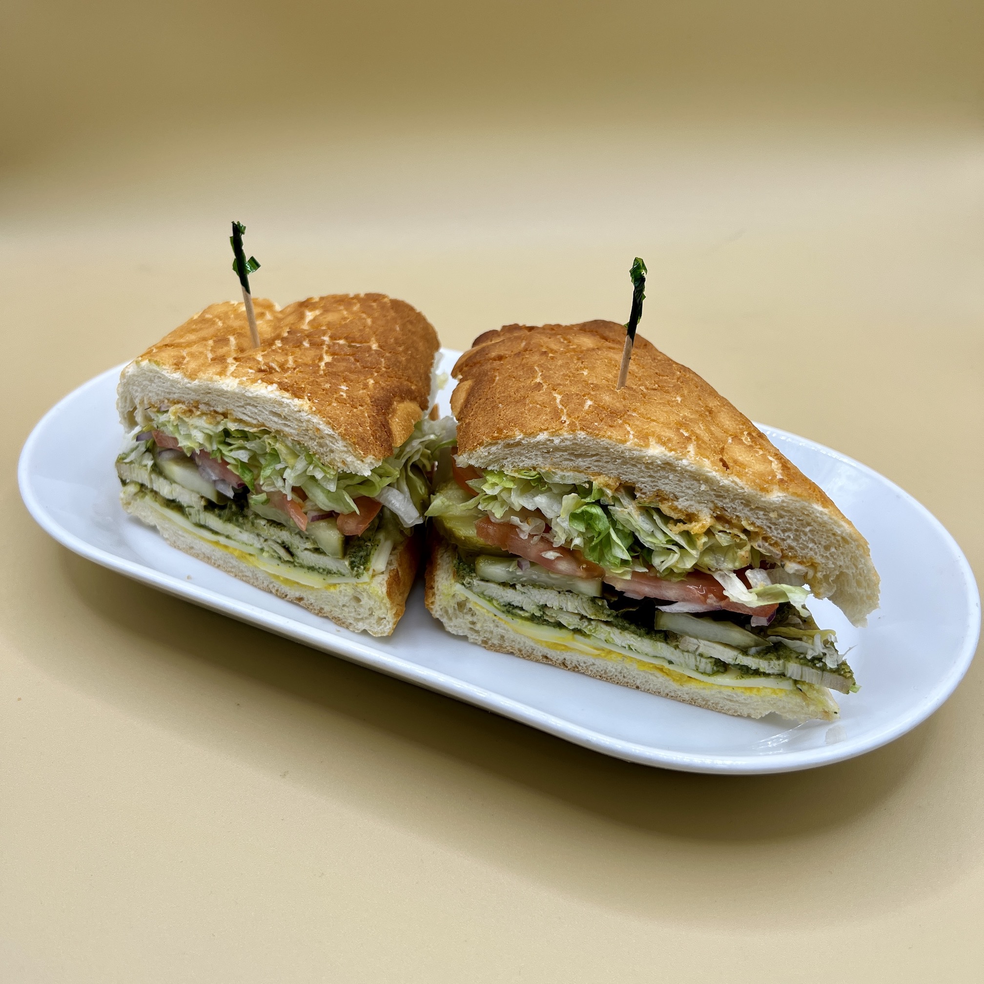 Order 18. Grilled Chicken Pesto Sandwich food online from Spreadz store, San Jose on bringmethat.com