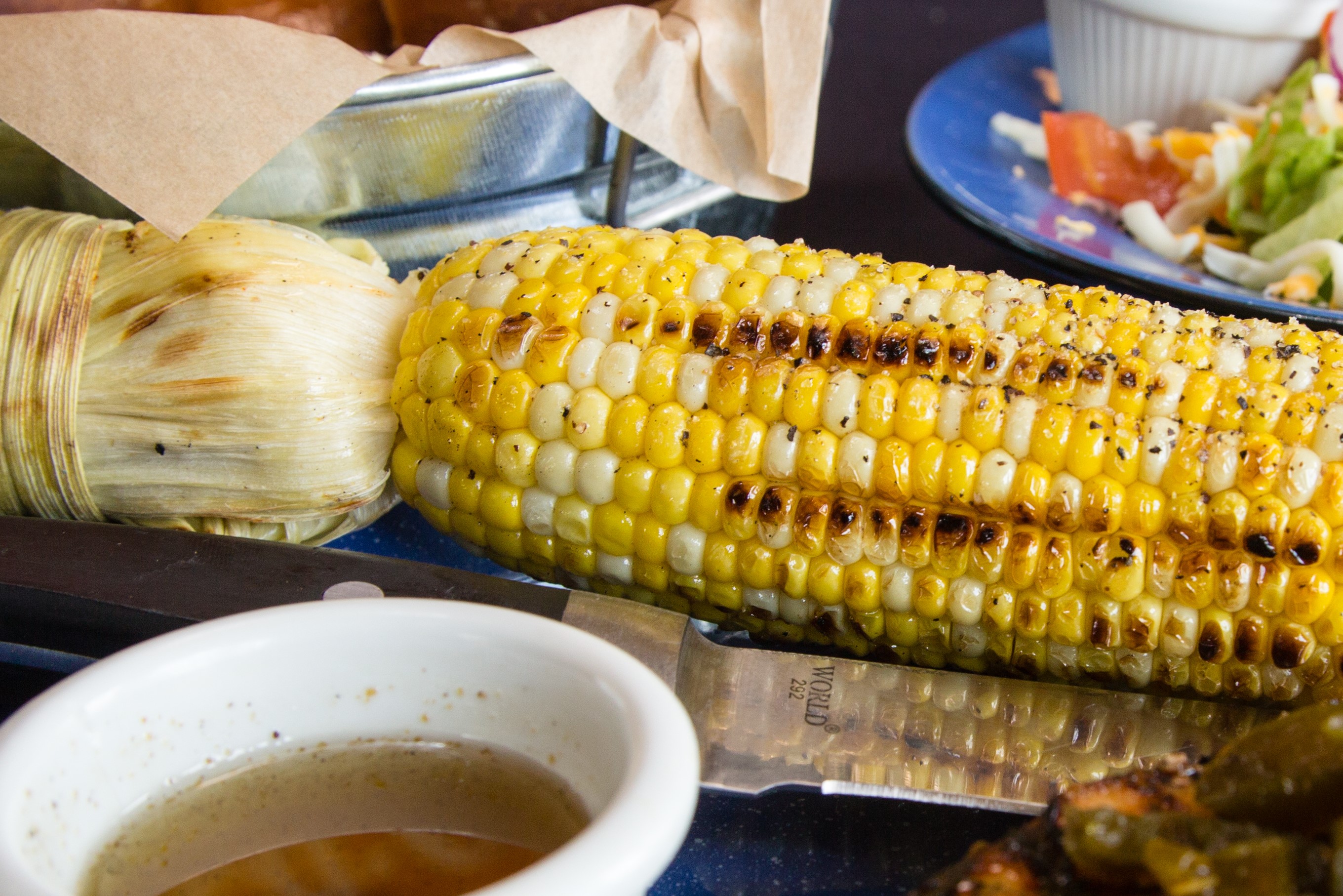 Order Roasted Corn on the Cob food online from Hoffbrau Steak & Grill House store, Amarillo on bringmethat.com