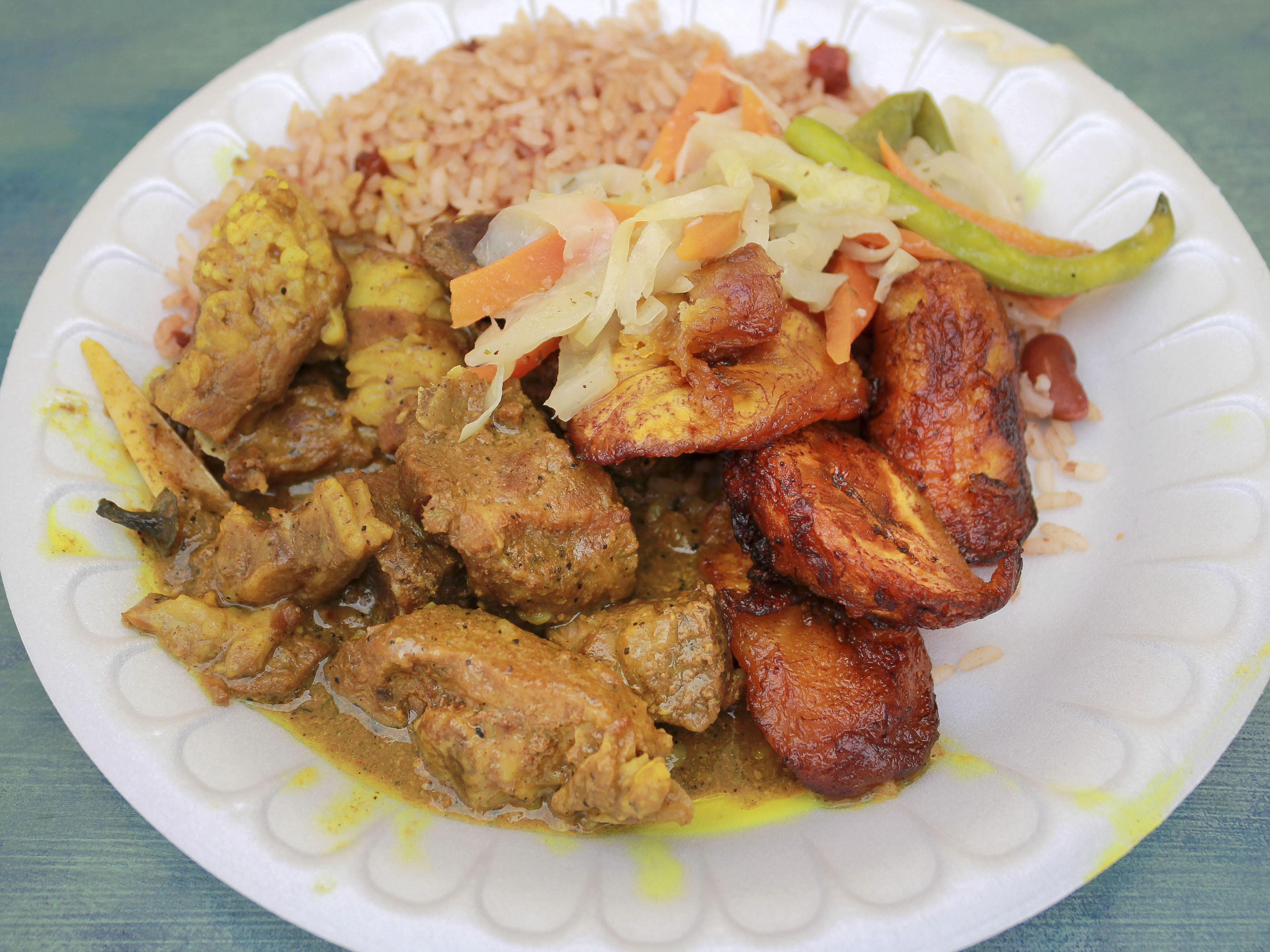 Order Curry Goat food online from Jerk Machine store, Fort Lauderdale on bringmethat.com