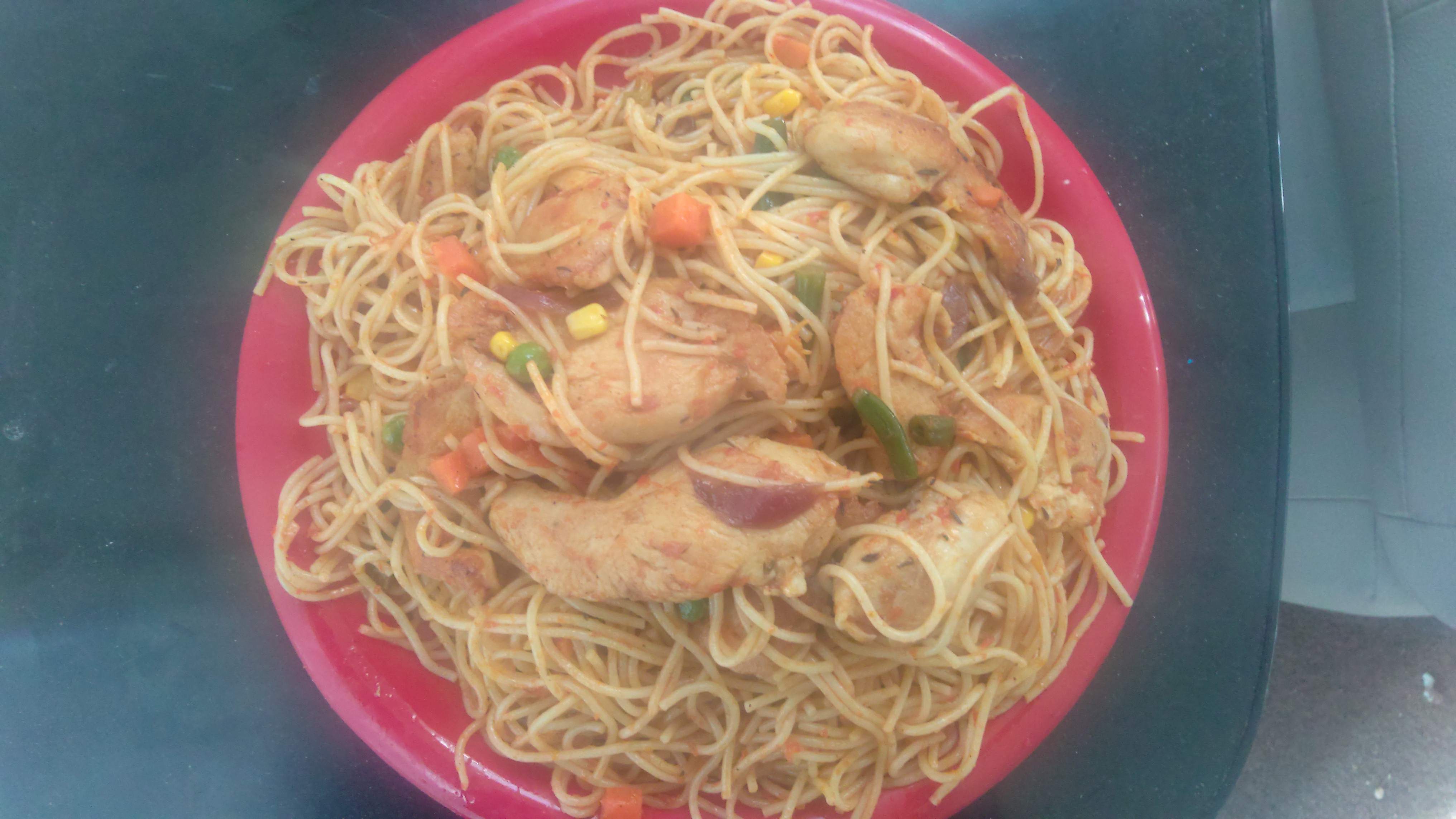 Order 3a. Jollof Spaghetti with grilled chicken food online from Africana Cuisine store, Perry Hall on bringmethat.com