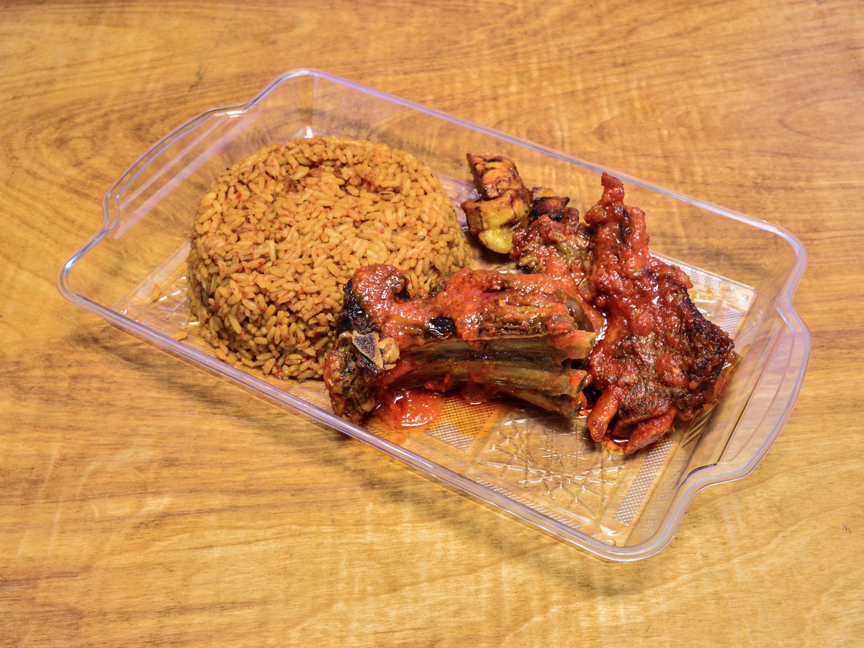 Order Jollof Meal with Goat food online from The Jollof Buka store, Indianapolis on bringmethat.com