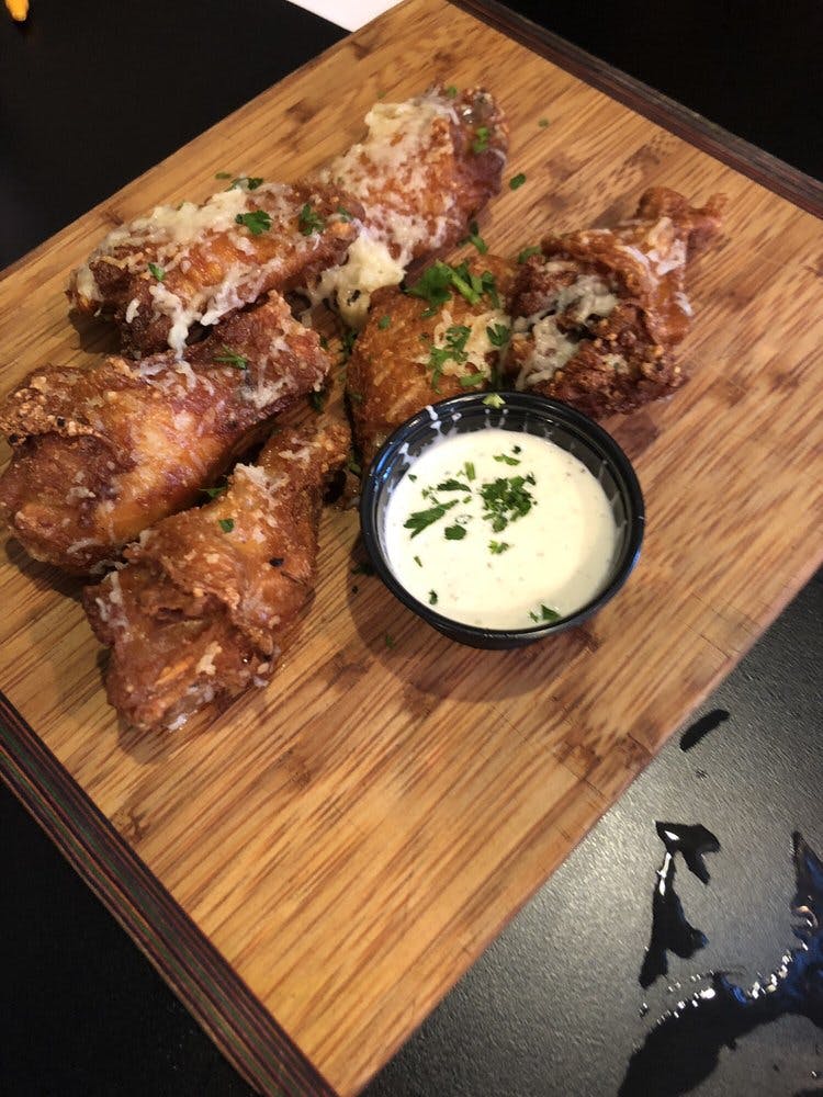 Order Oven Baked Chicken Wings - 4 Pieces food online from The Brick Oven Bistro store, Sandusky on bringmethat.com