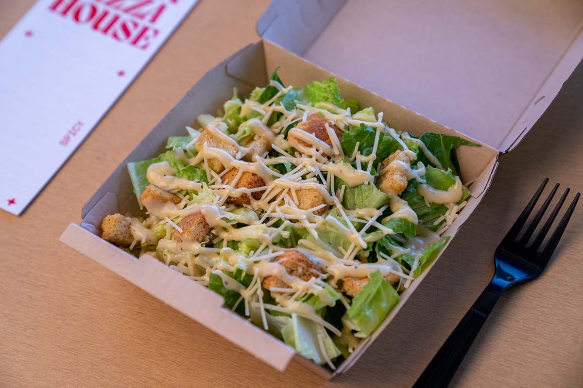 Order Caesar salad food online from Pizza Zombie store, Fremont on bringmethat.com