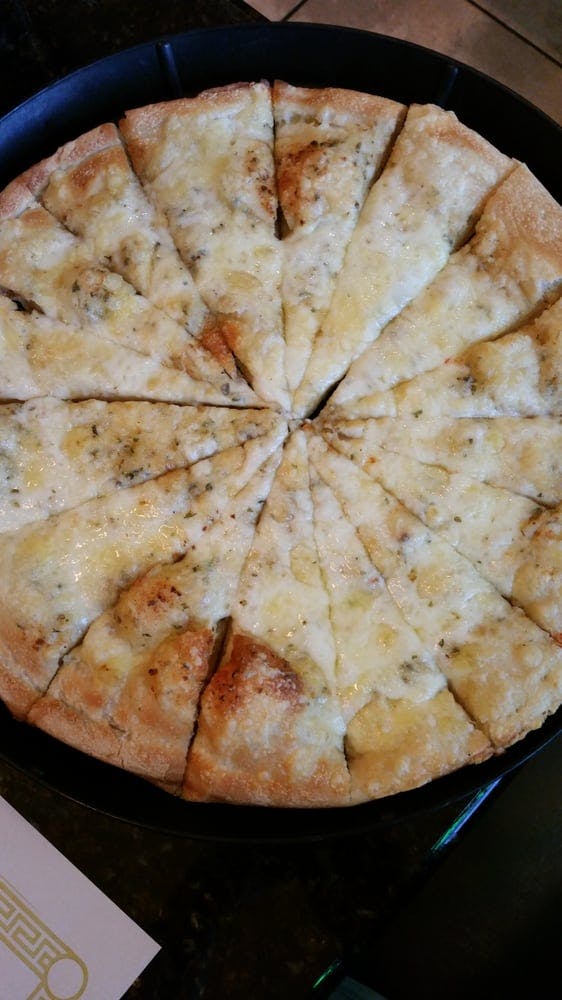 Order Peddler's Famous Cheesy Garlic Bread - Appetizer food online from Pizza Peddler store, West Chester on bringmethat.com