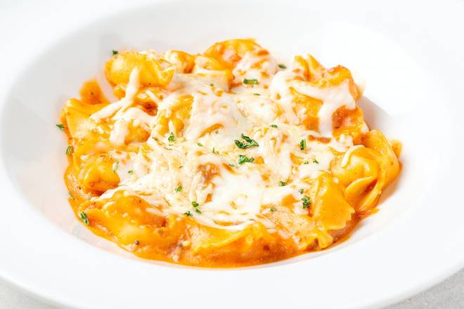 Order BAKED CHEESE TORTELLONI food online from Johnny Carino store, Wichita Falls on bringmethat.com