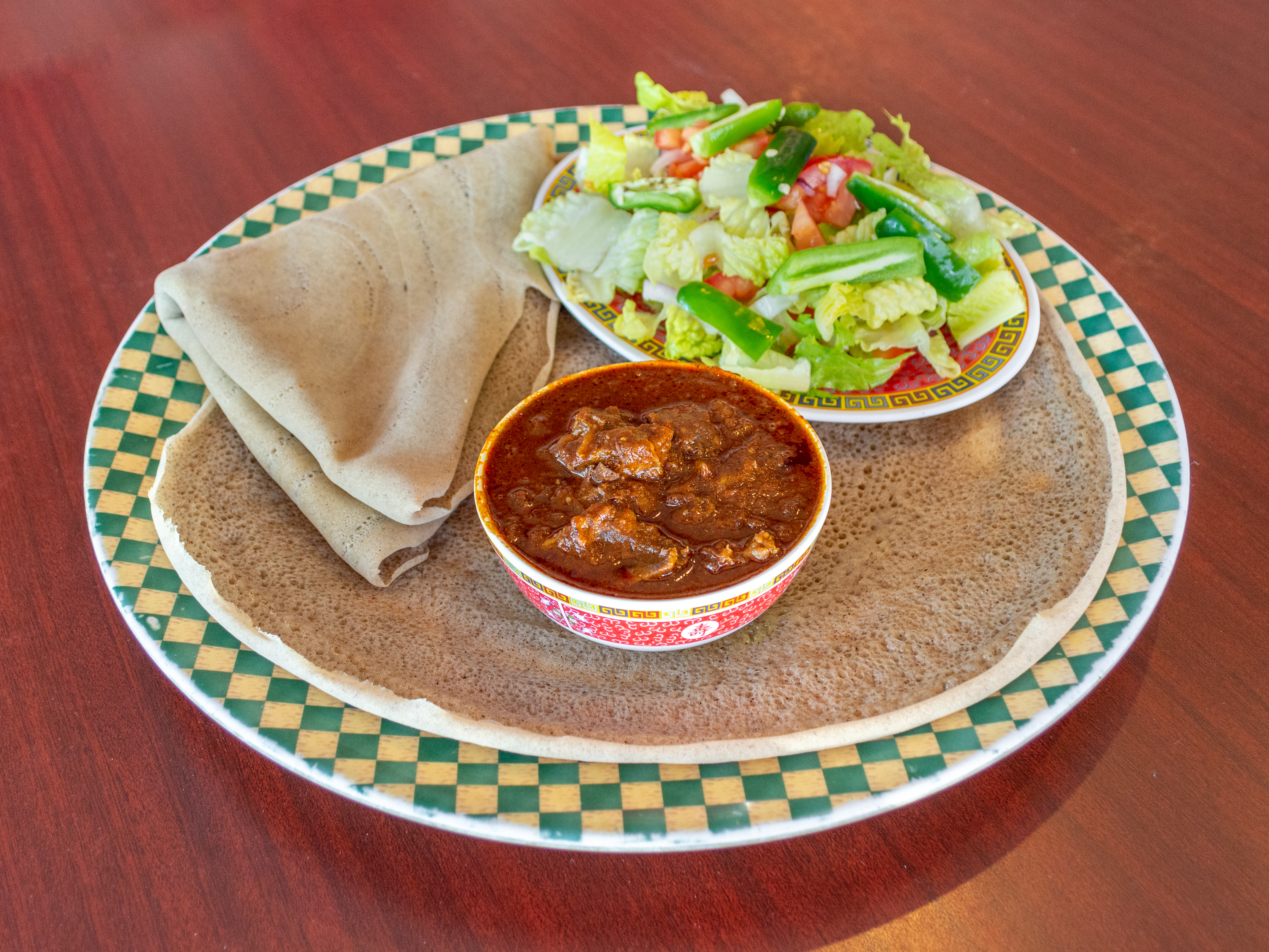 Order 12. Siga Firfir food online from Enat Ethiopian Restaurant store, Seattle on bringmethat.com