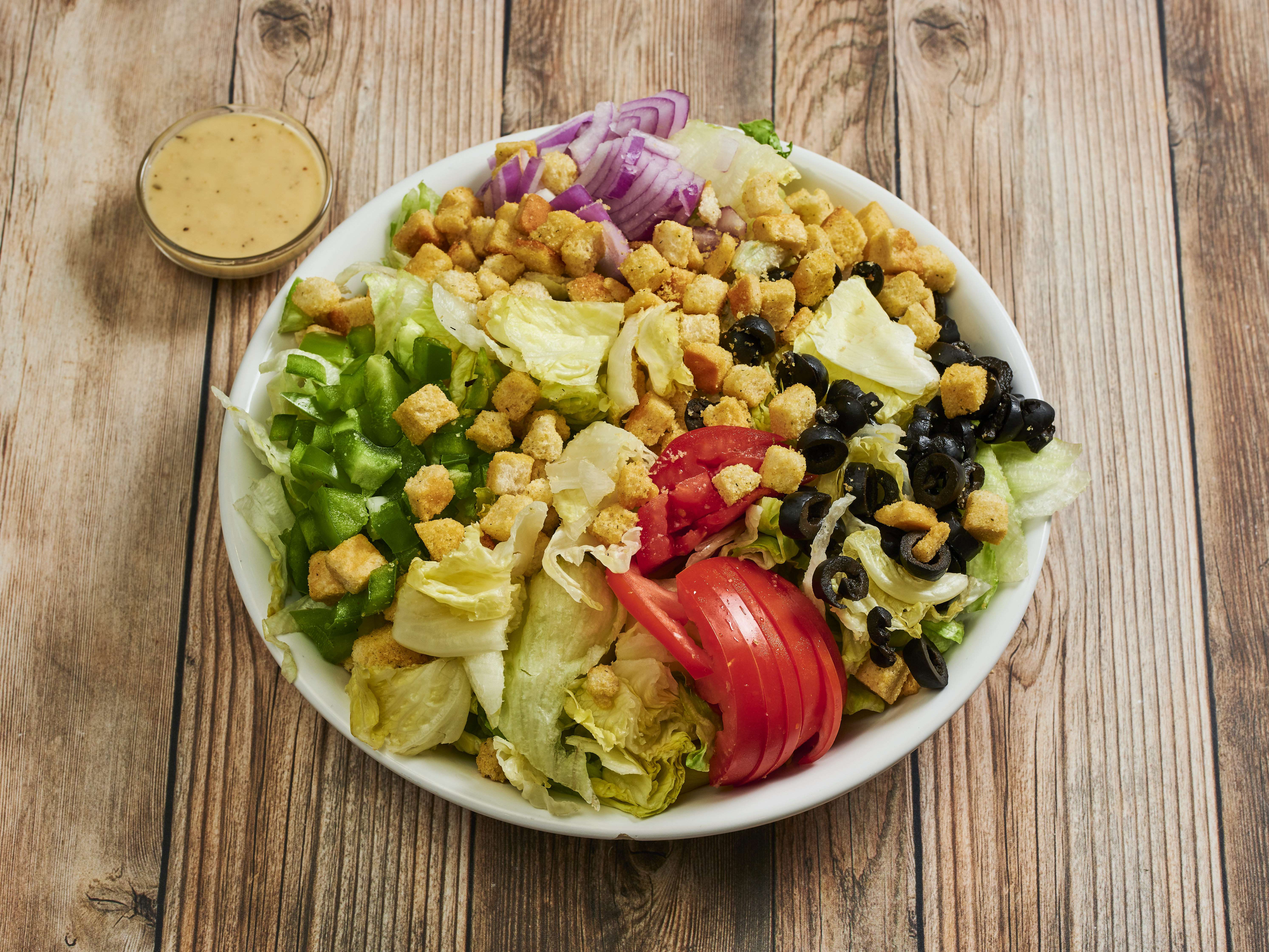 Order Caesar Salad food online from Pizza Guy store, Studio City on bringmethat.com