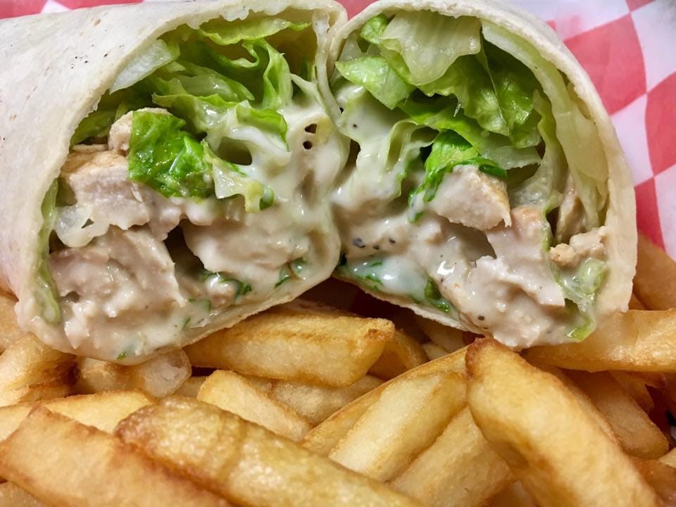 Order Chicken Caesar Wrap - Wrap food online from Nino's Pizzarama store, Willow Grove on bringmethat.com