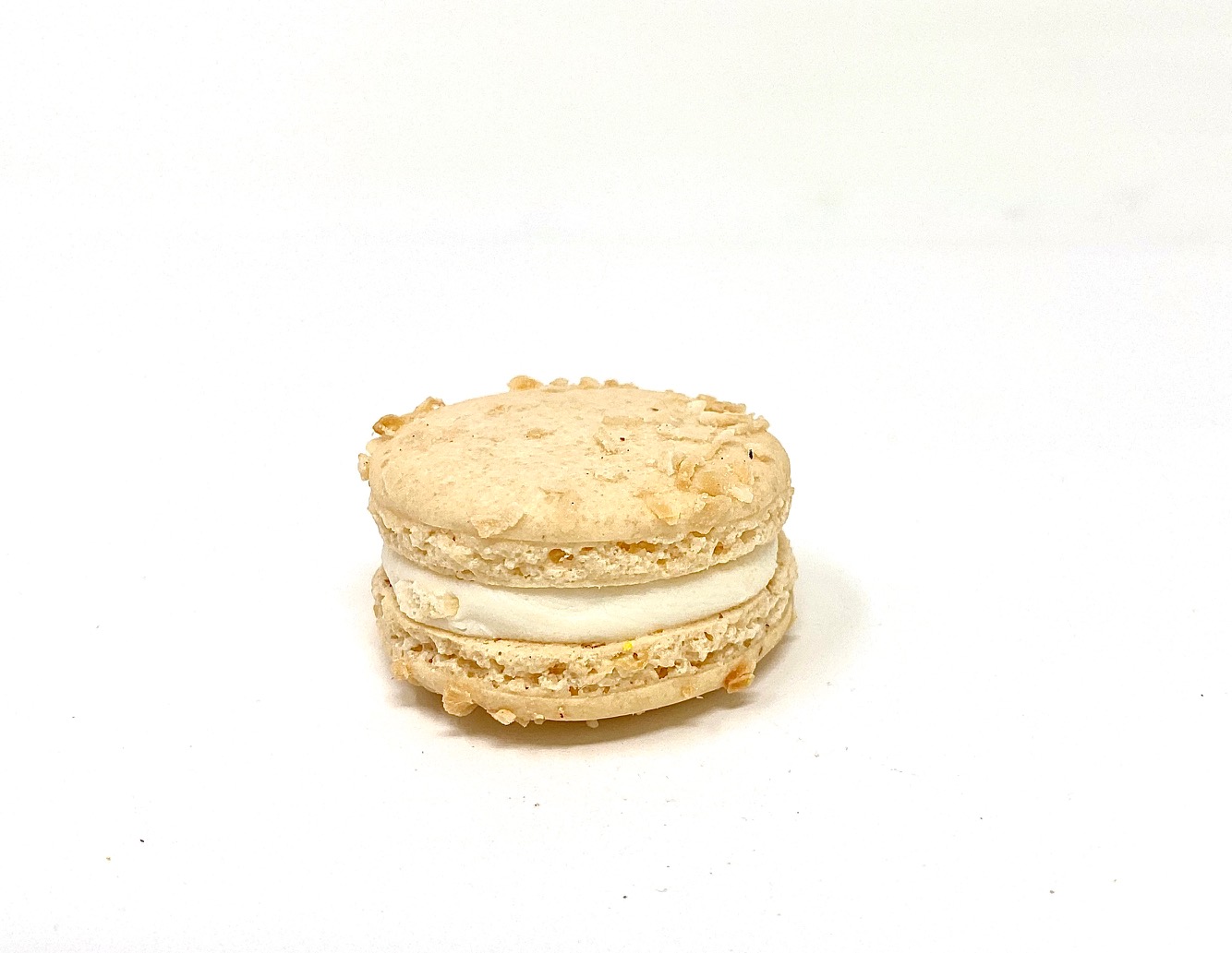 Order Toasted Coconut Macaron food online from Joy And Sweets store, Culver City on bringmethat.com