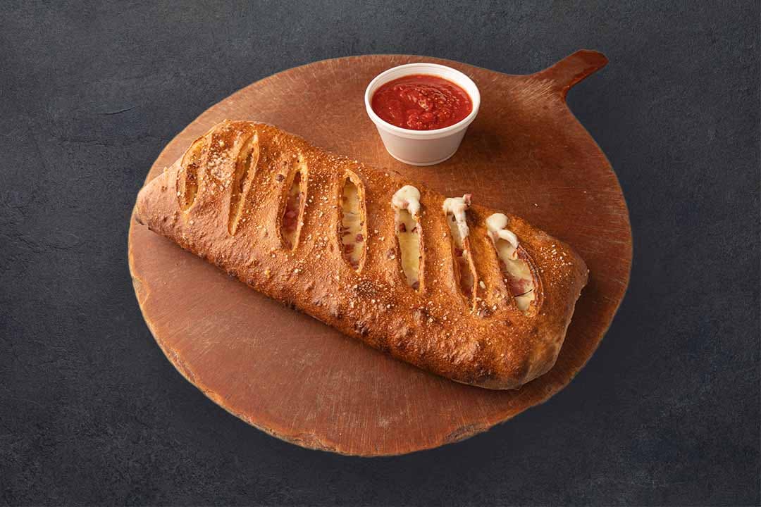 Order Work's Stromboli - Half food online from Westshore Pizza store, Tampa on bringmethat.com