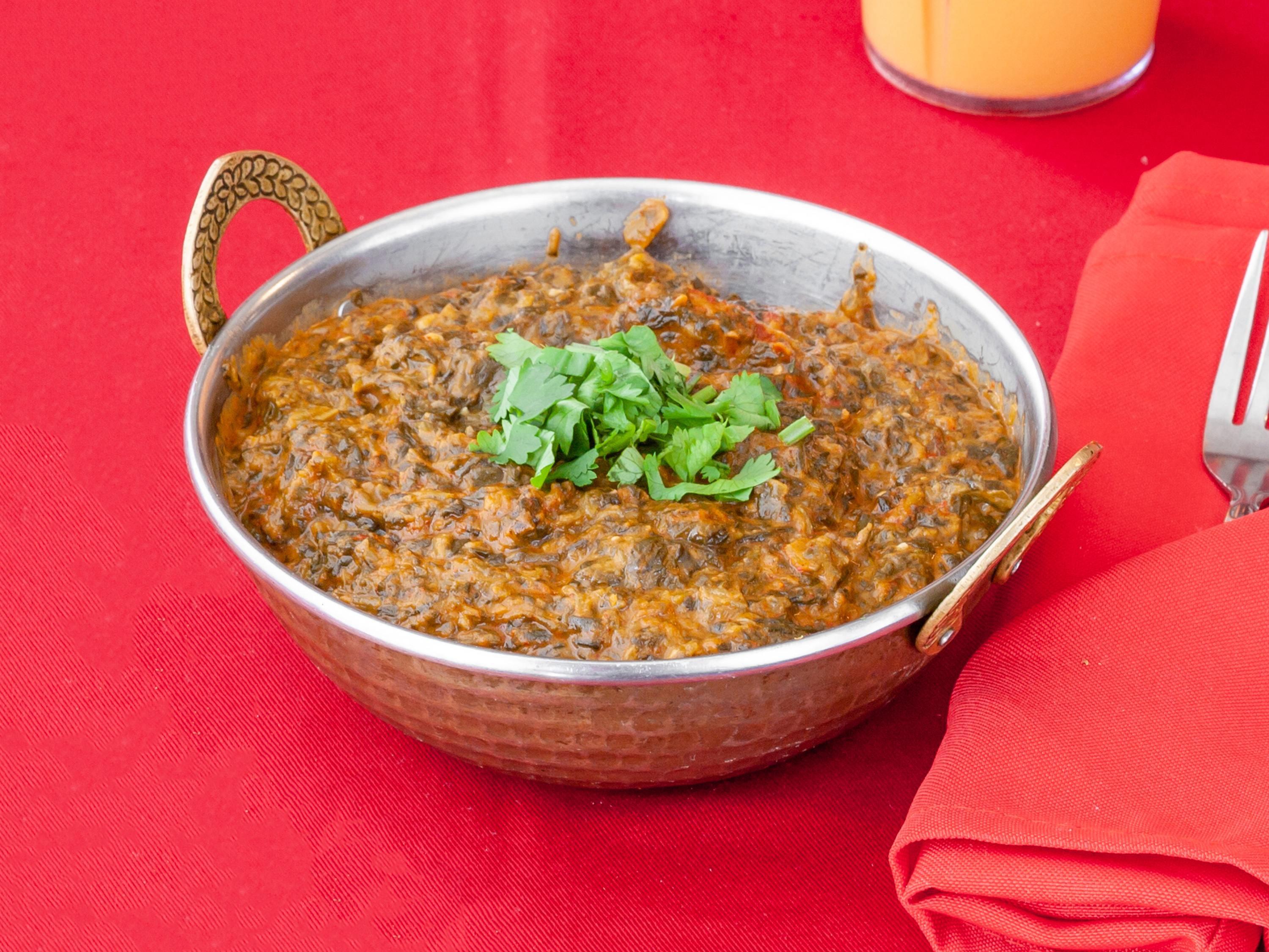 Order 83. Lamb Saag food online from Ambar Indian Restaurant store, Champaign on bringmethat.com