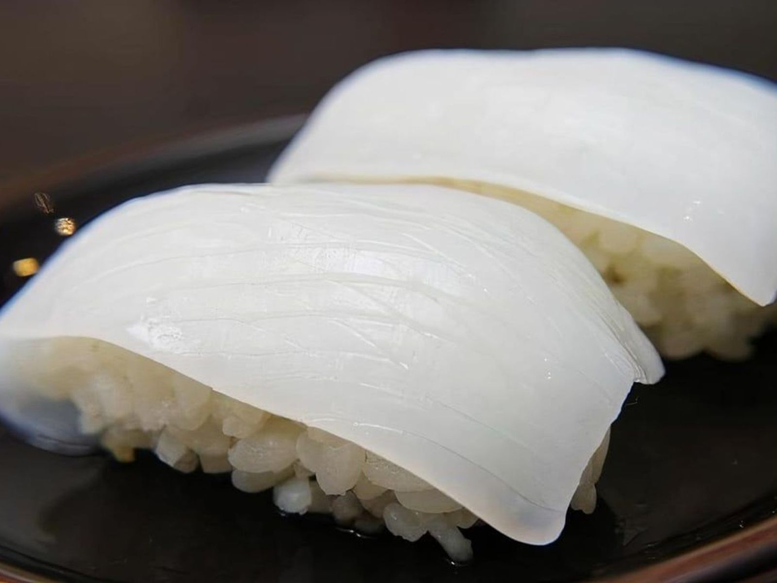 Order Ika Nigiri food online from Sushi Aoi store, Washington on bringmethat.com