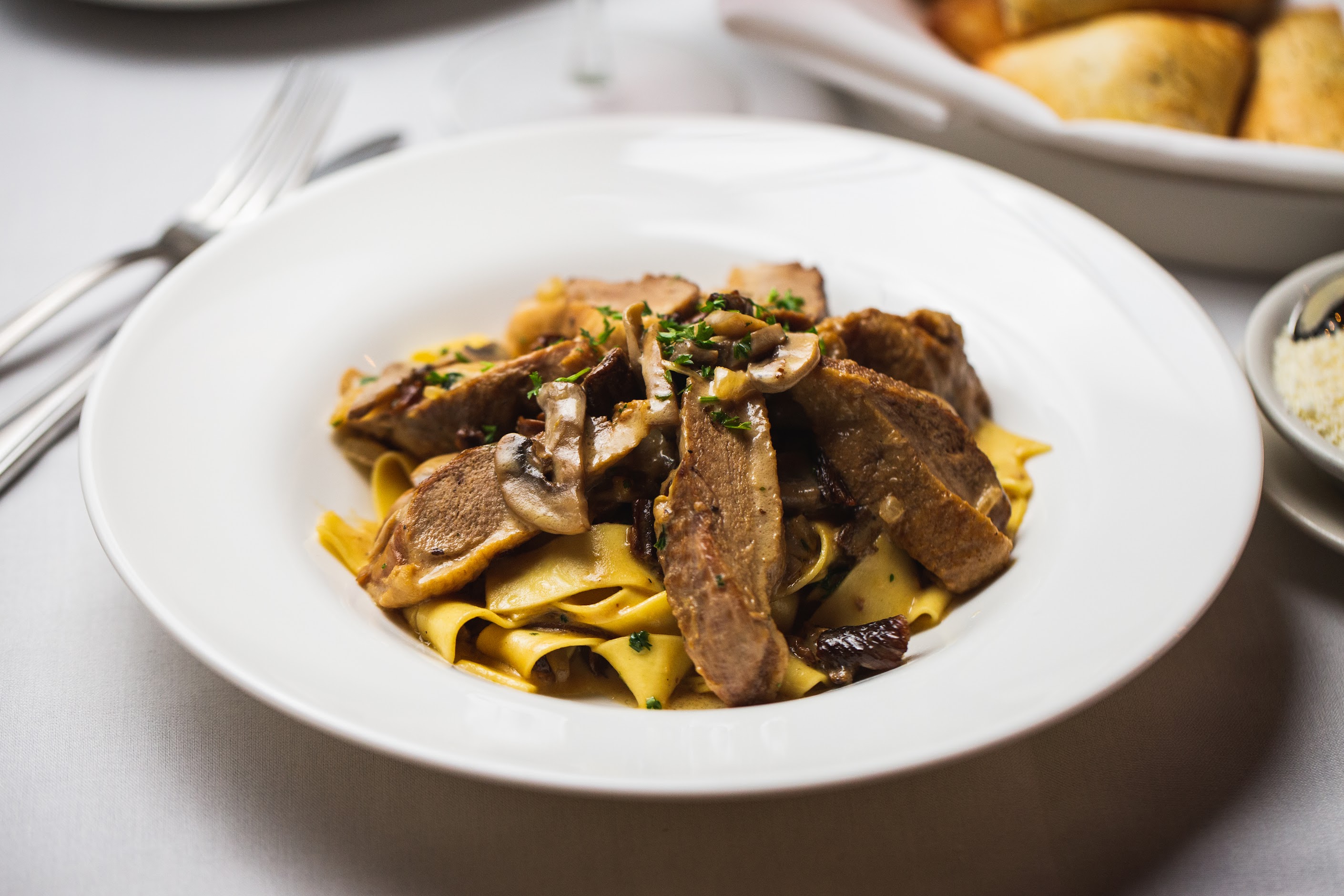 Order Pappardelle Duck Porcini food online from Bellini store, New York on bringmethat.com