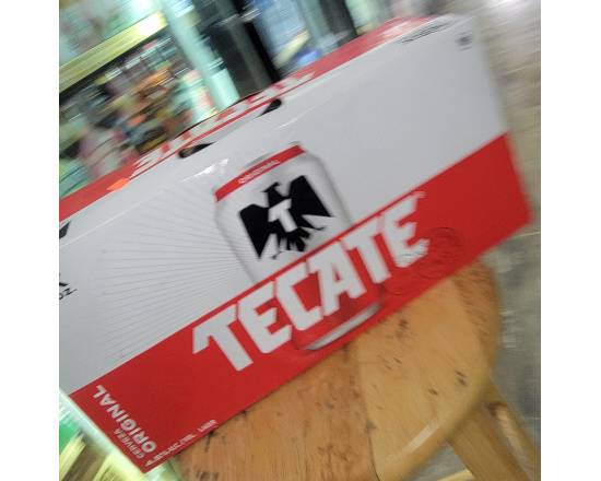 Order TECATE 18PK. 12OZ. CANS food online from Hub Market & Deli store, San Diego on bringmethat.com