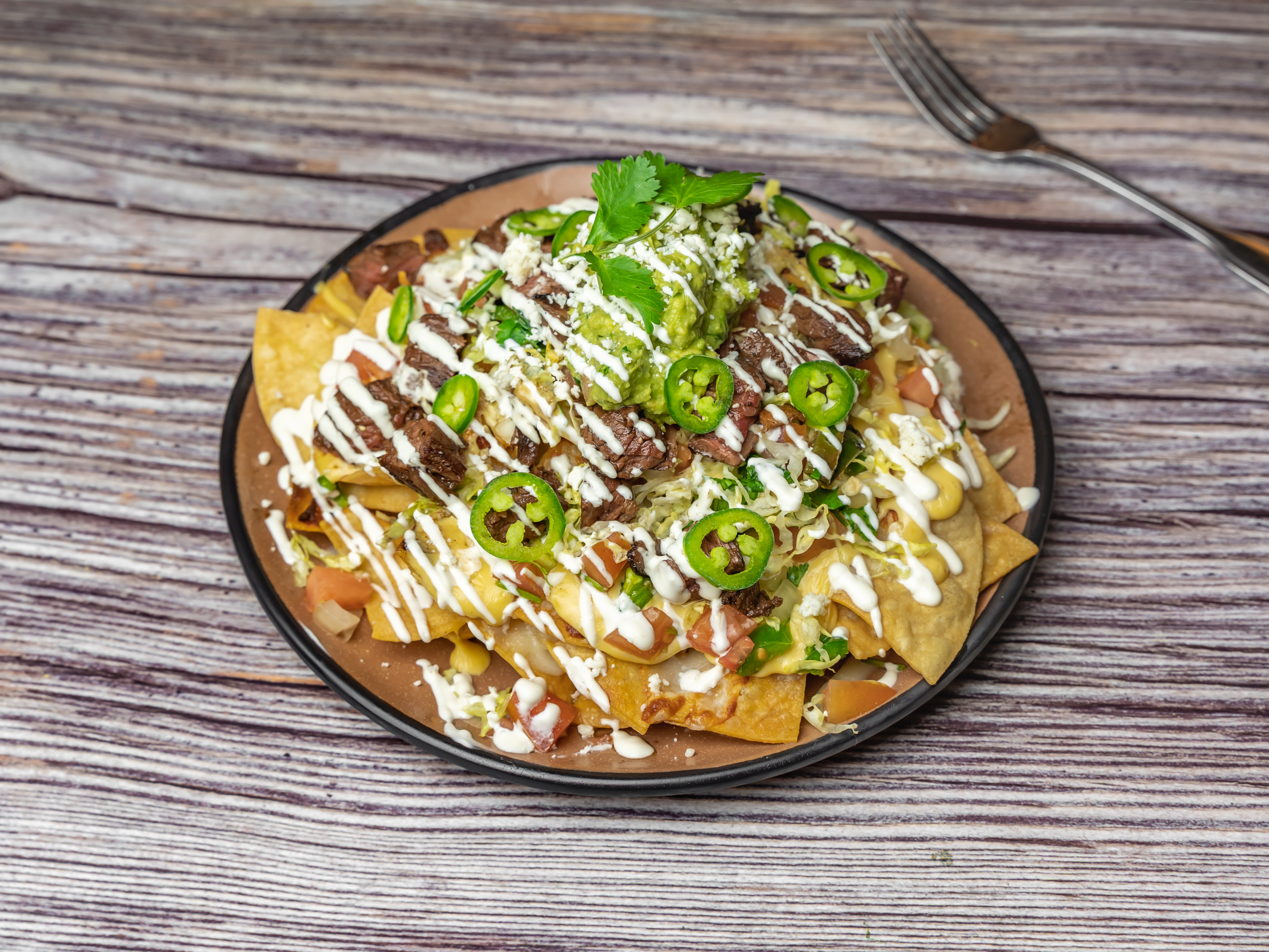 Order Nachos food online from Tejas Forever store, San Francisco on bringmethat.com