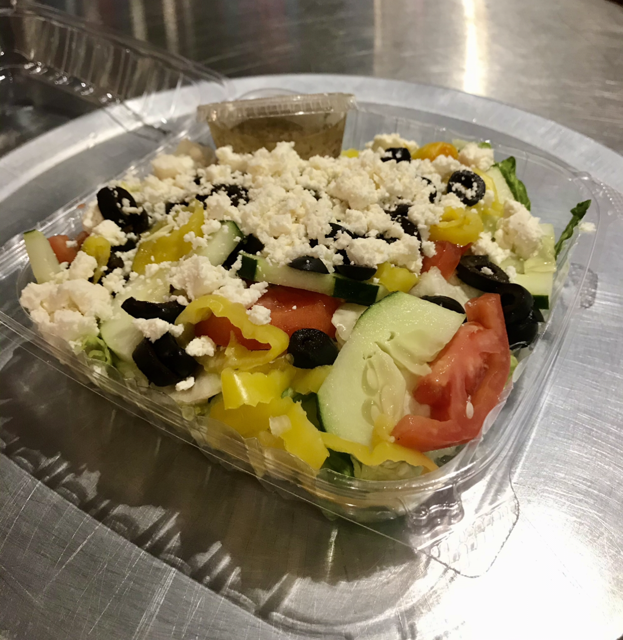 Order Greek Salad food online from Johnny's Pizza store, Cary on bringmethat.com