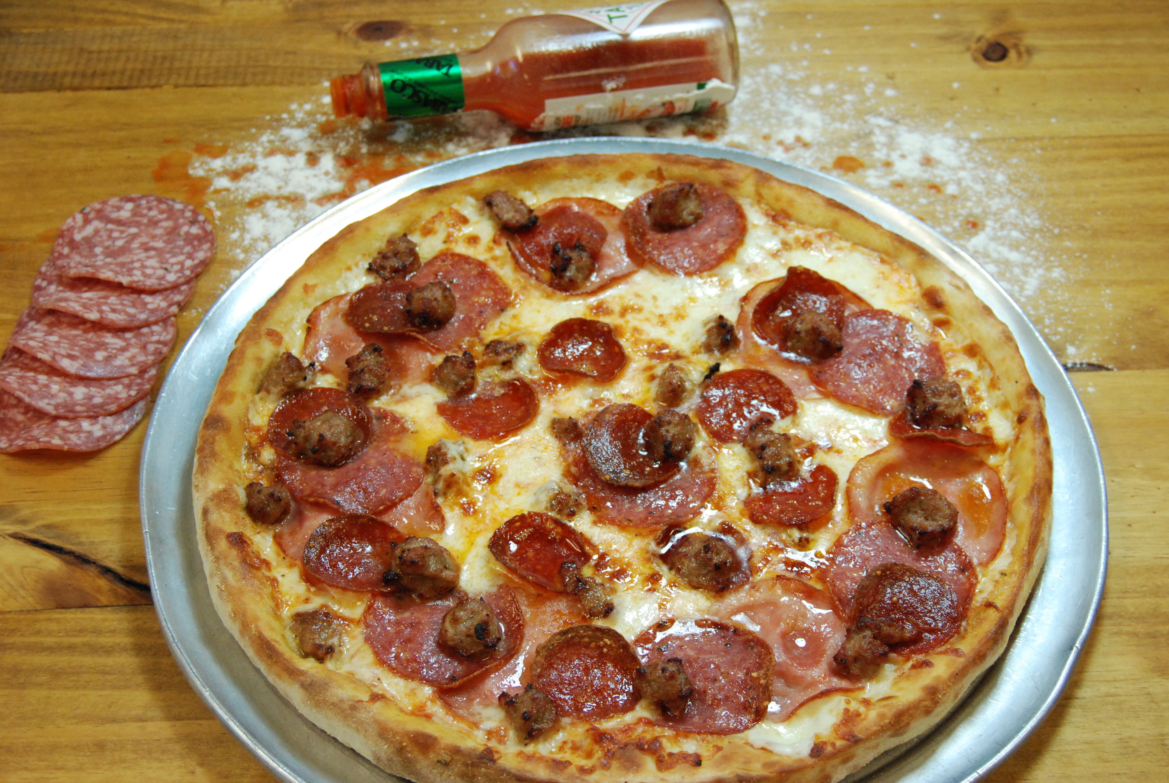 Order Meat Lover's Pizza - Medium 12'' food online from Stefano's Pizza store, Novato on bringmethat.com
