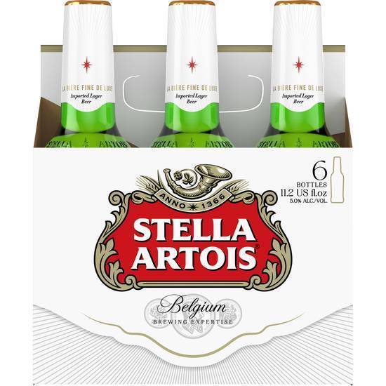 Order Stella Artois, 6pk-12oz bottle beer (5.2% ABV) food online from Flow Liquor store, Compton on bringmethat.com