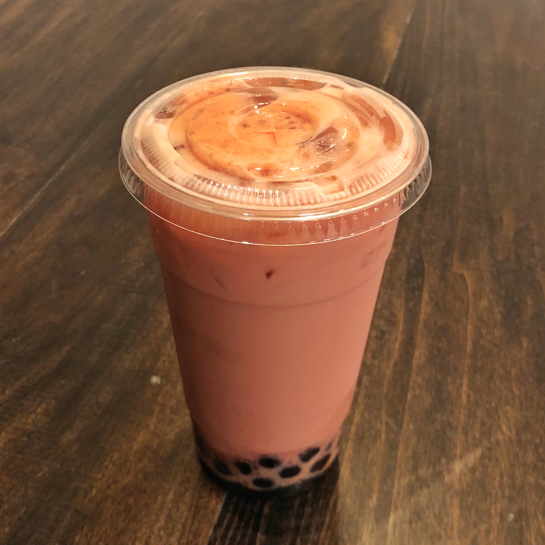 Order Strawberry Milk Tea food online from Isshin Ramen & Boba store, Los Angeles on bringmethat.com