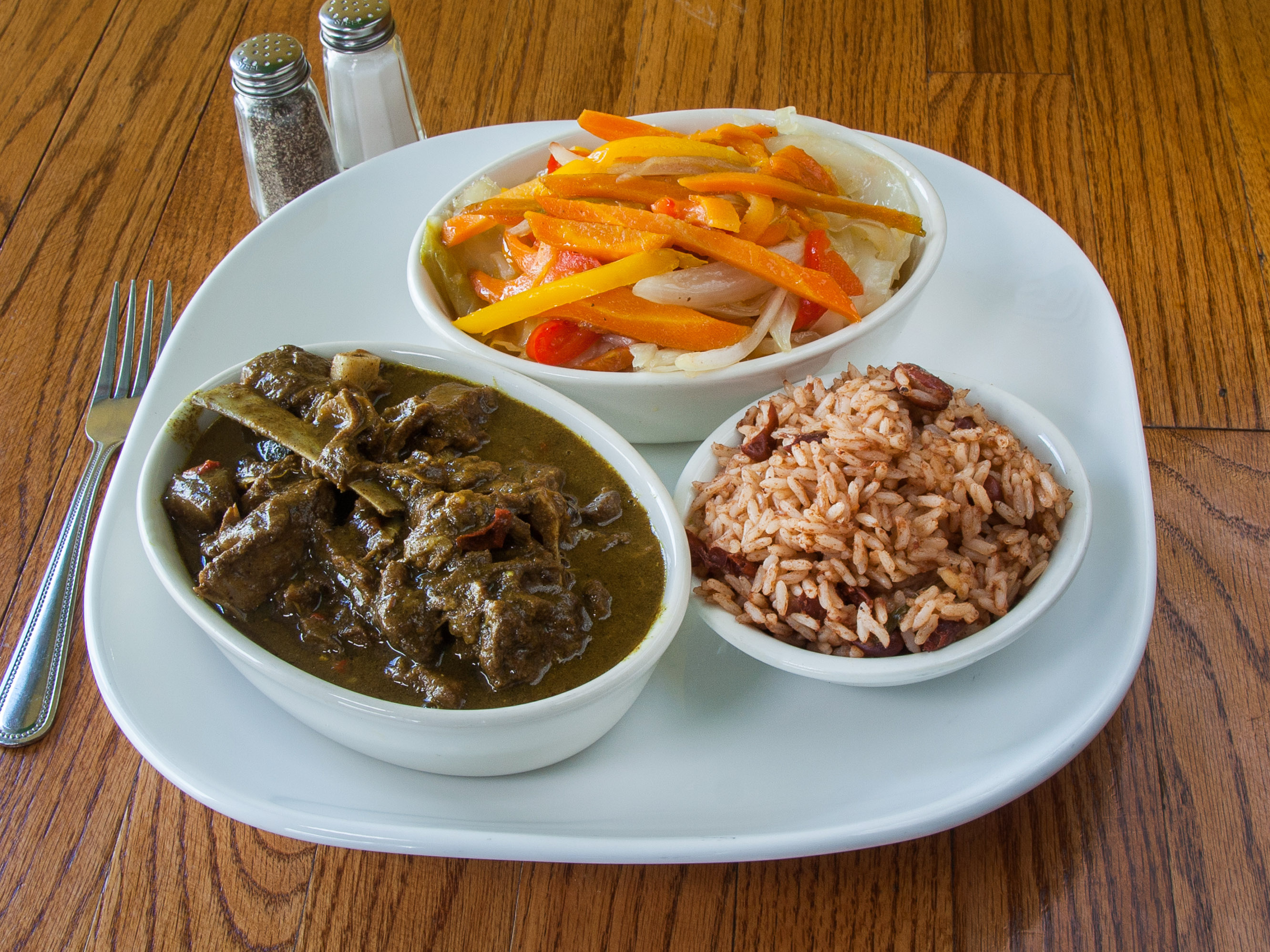 Order Curry Goat Dinner food online from Jerk Flavors Restaurant And Lounge store, Markham on bringmethat.com