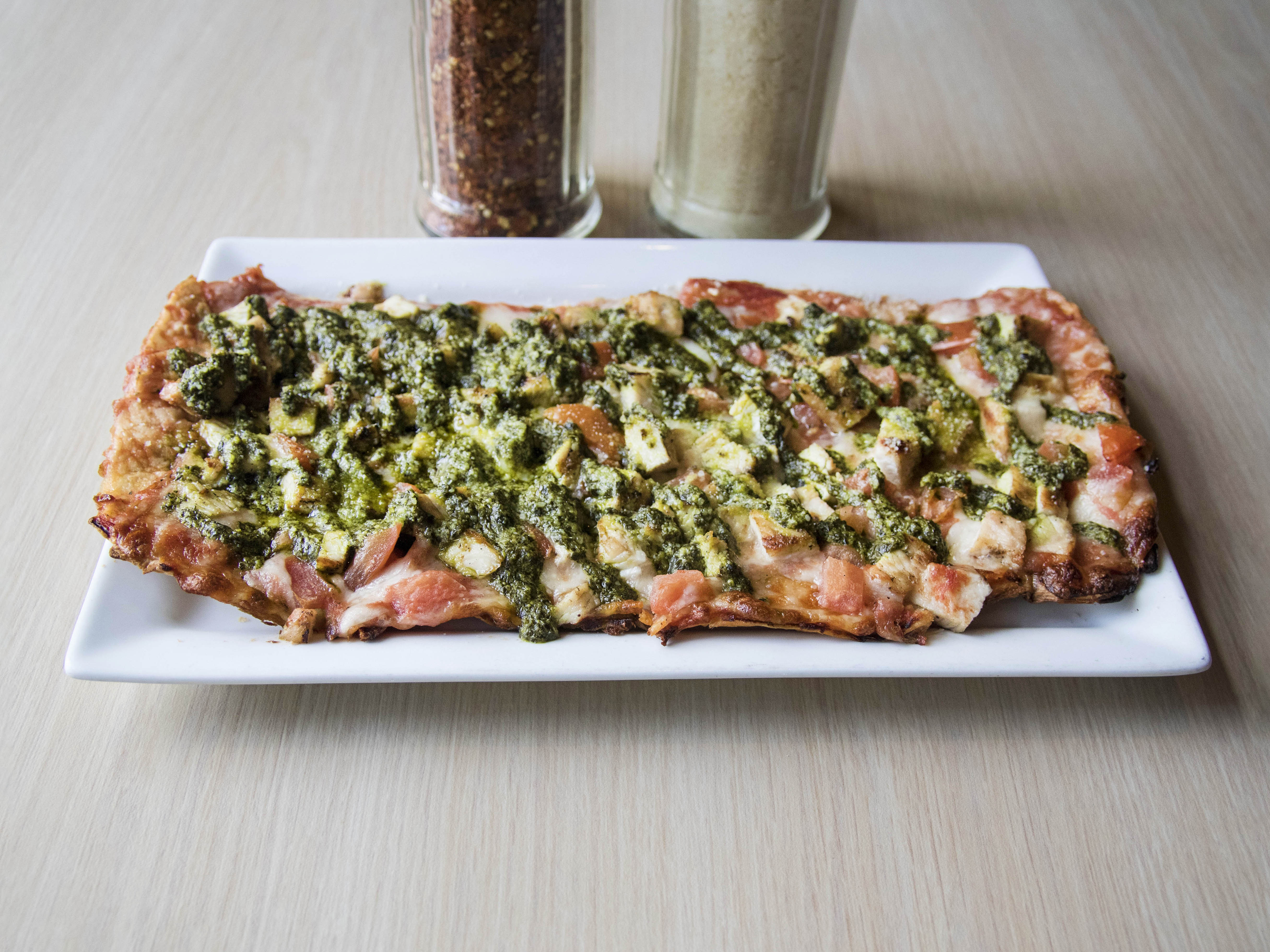 Order Pesto Chicken Flatbread food online from Shakers Bar and Grill store, Wixom on bringmethat.com