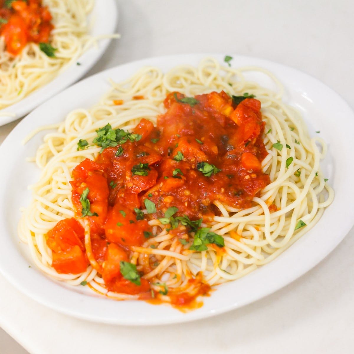 Order Spaghetti with Tomato Sauce - Pasta food online from Italian Pizzeria store, Durham on bringmethat.com