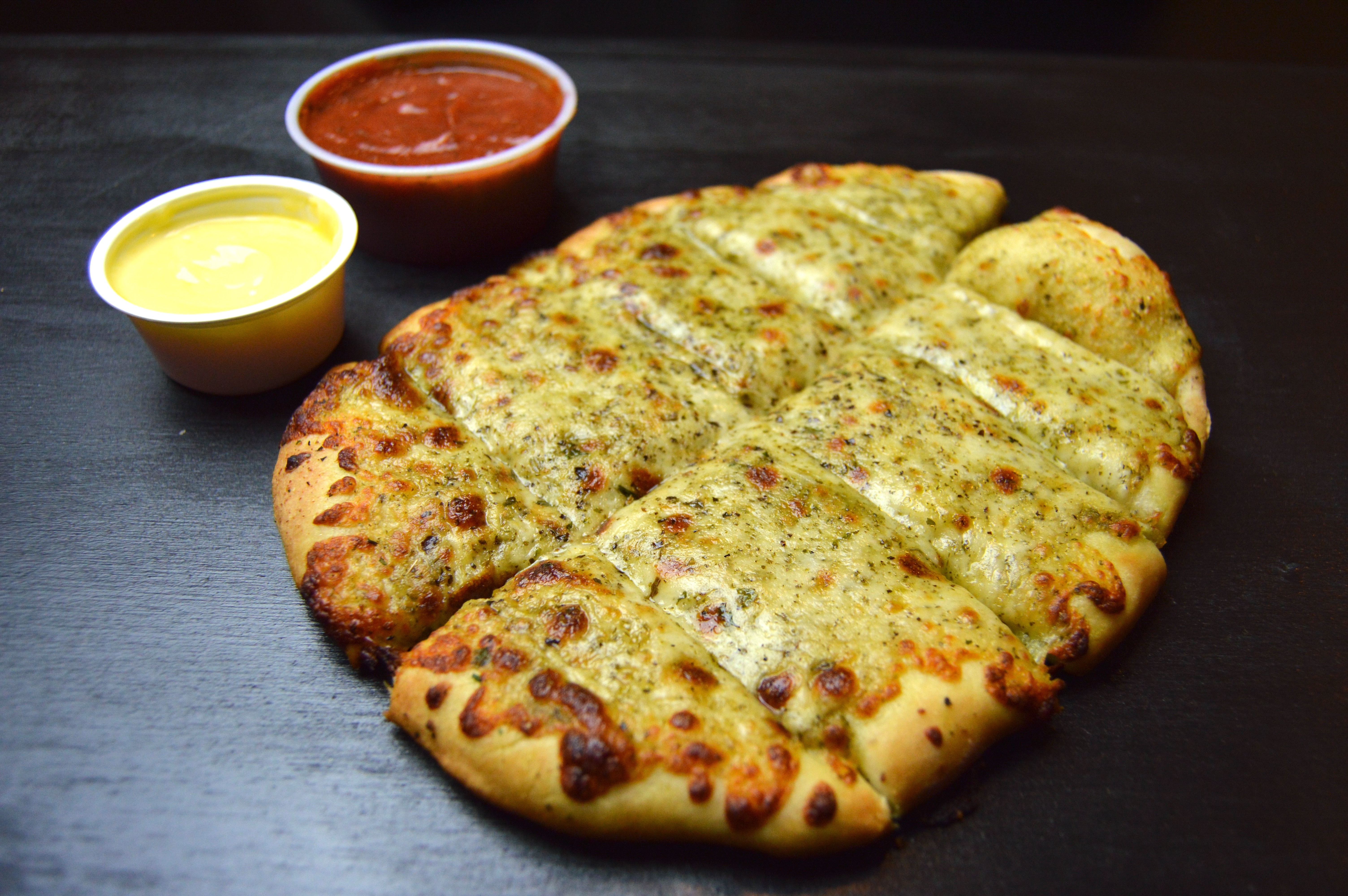 Order Pesto Stix food online from D.P. Dough store, Fort Collins on bringmethat.com