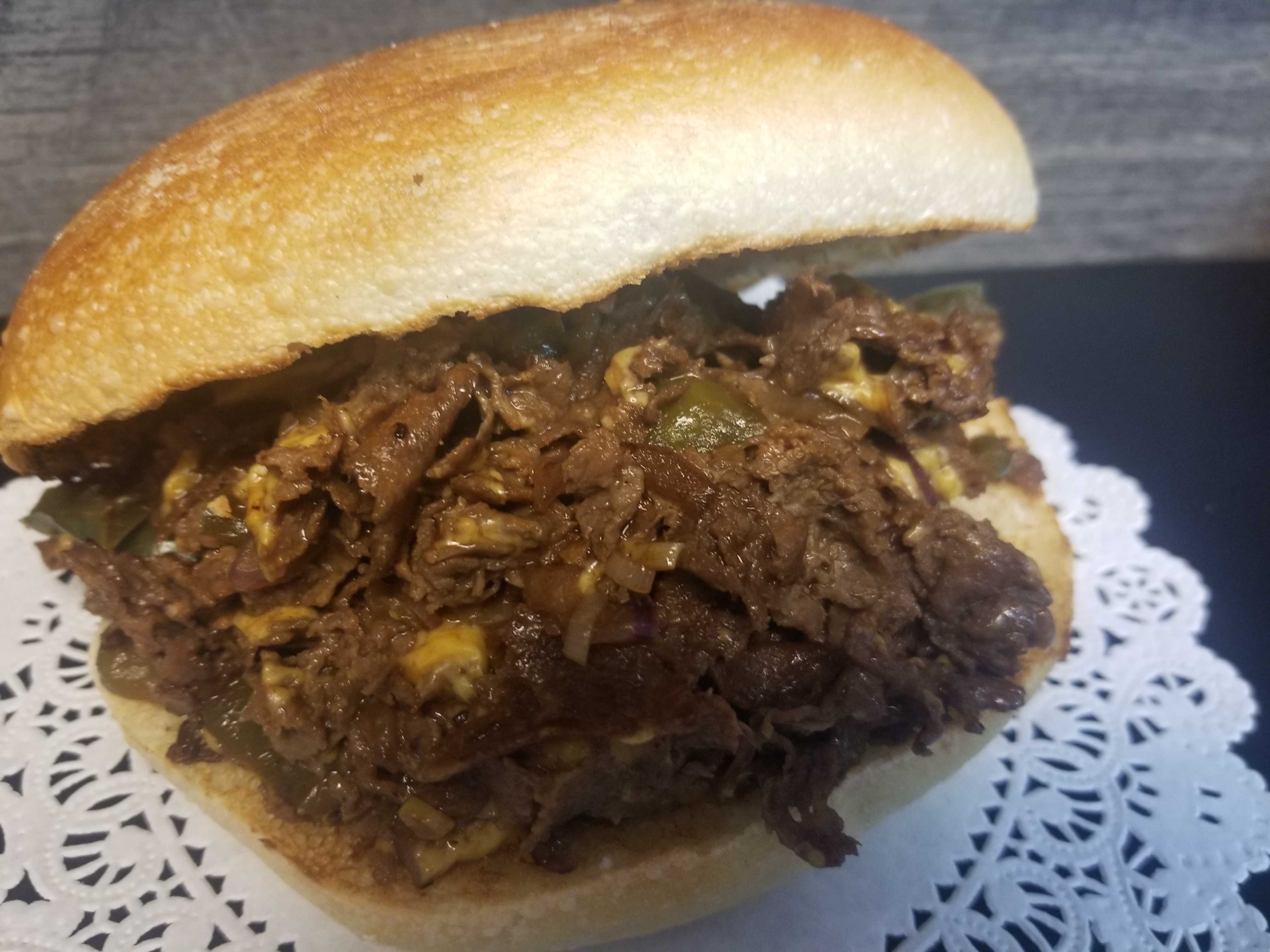 Order Philly Cheesesteak Sandwich food online from Brunella Portuguese Coffee & Deli store, Westfield on bringmethat.com