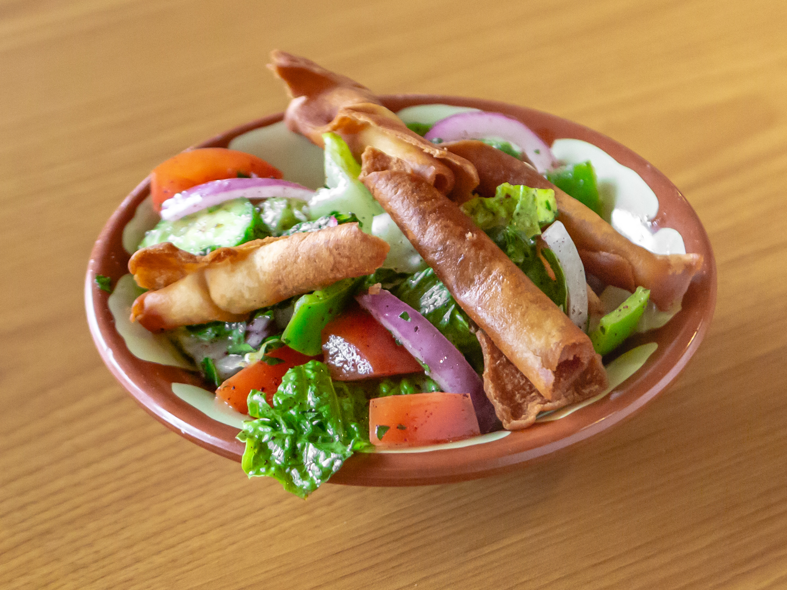 Order Greek Salad food online from Alwadi Cafe store, Bedford on bringmethat.com