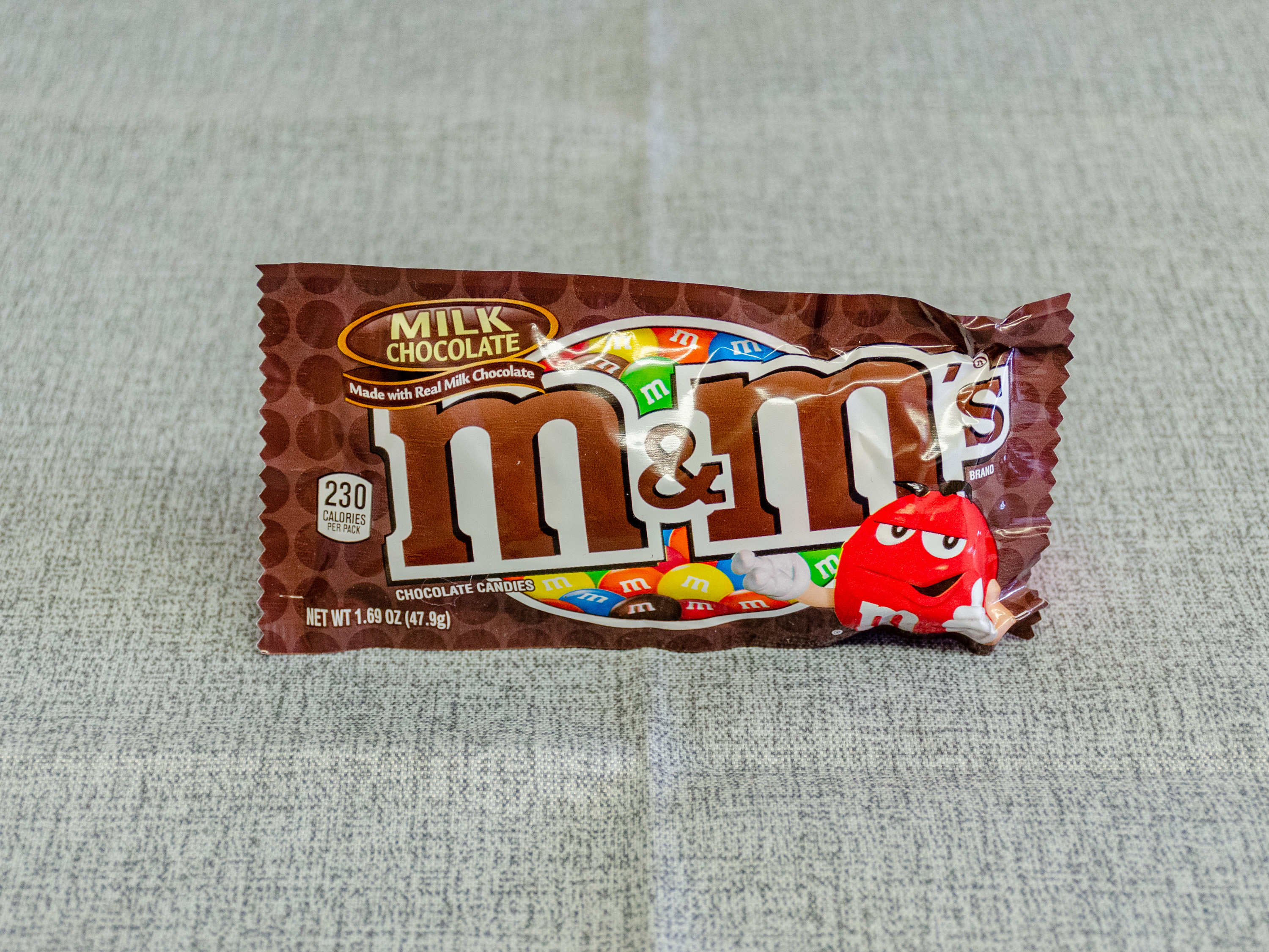 Order 1.69 oz. Milk Chocolate M&M’s  food online from Just Dash It store, Englewood on bringmethat.com