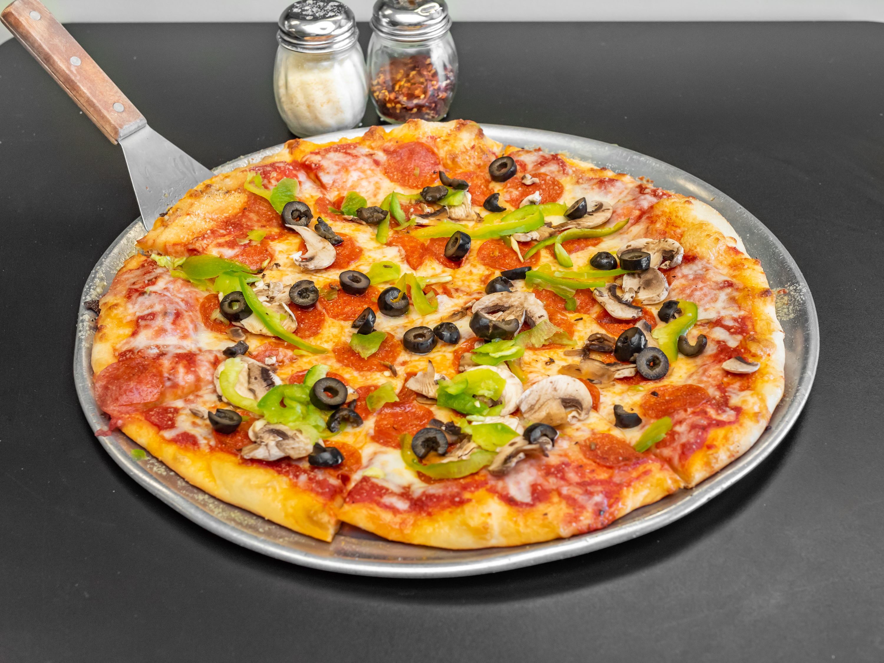 Order Combination Pizza food online from Tonti's Pizzeria store, Parker on bringmethat.com