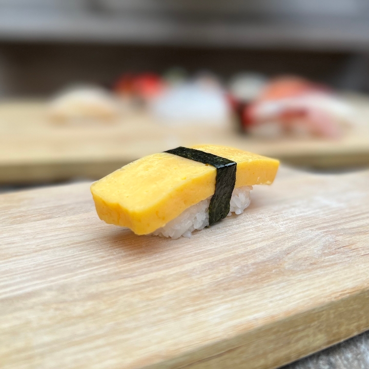 Order Tamago Nigiri food online from Tanuki sushi store, Chicago on bringmethat.com