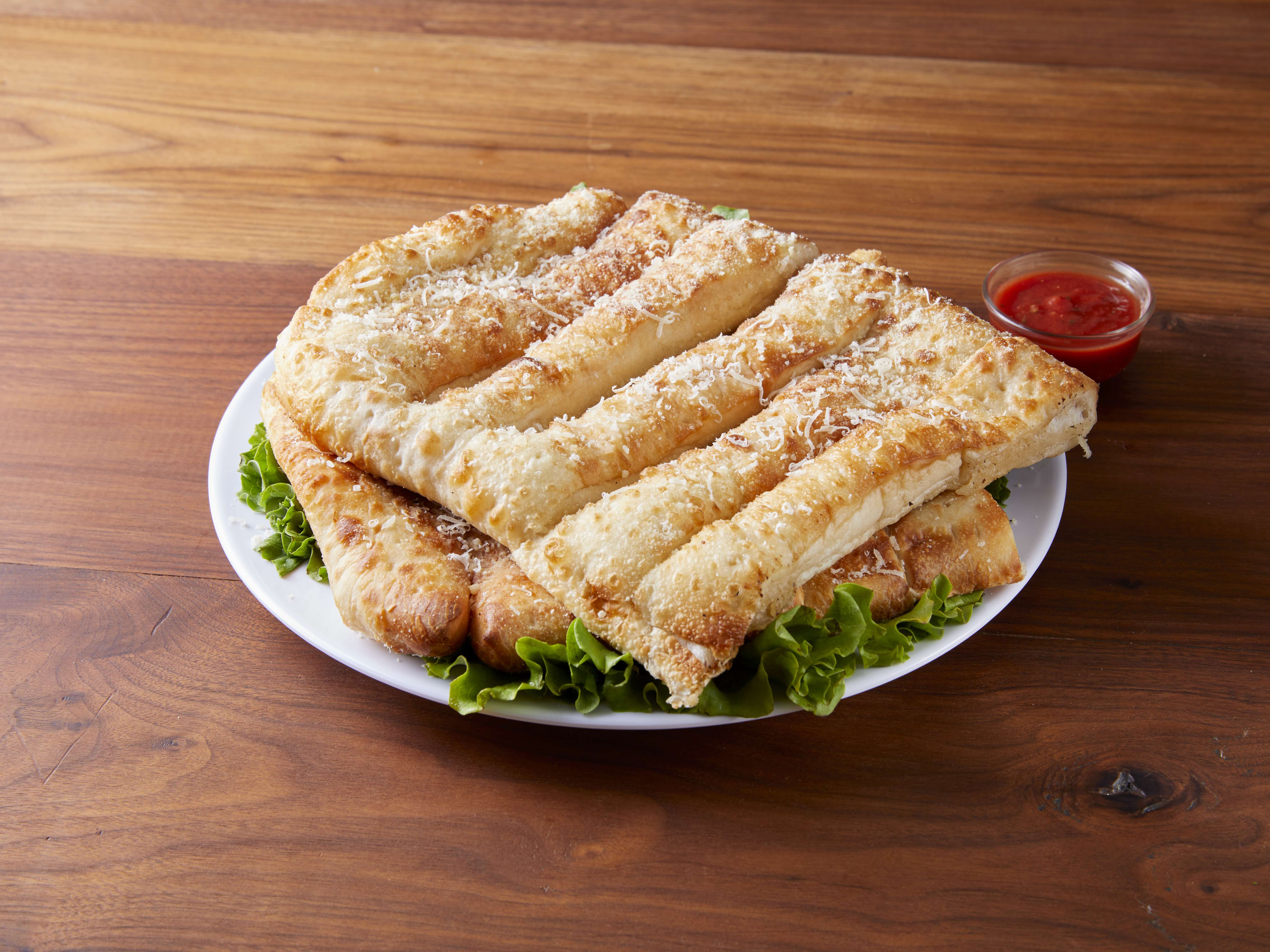 Order 12 Piece Bread Sticks food online from Happy's Pizza store, Sterling Heights on bringmethat.com