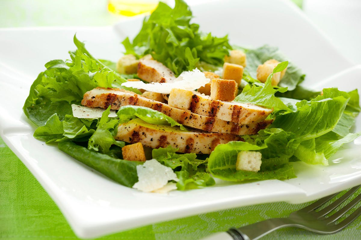 Order Grilled Chicken Caesar Salad - Small food online from Golden Pizzeria store, Norfolk on bringmethat.com