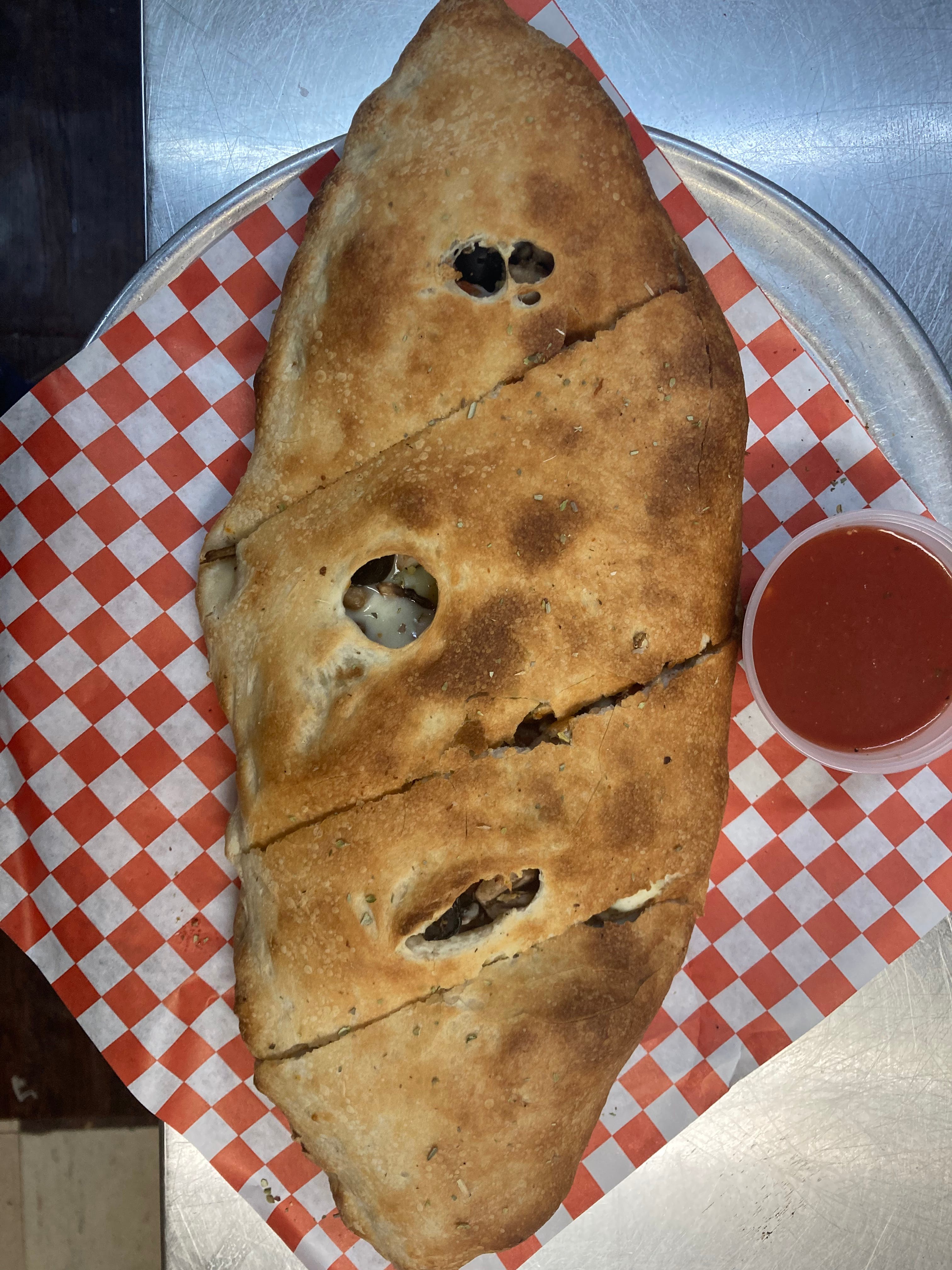 Order The Mediterranean Calzone - Calzone food online from Two Guys Pizzeria store, Houston on bringmethat.com