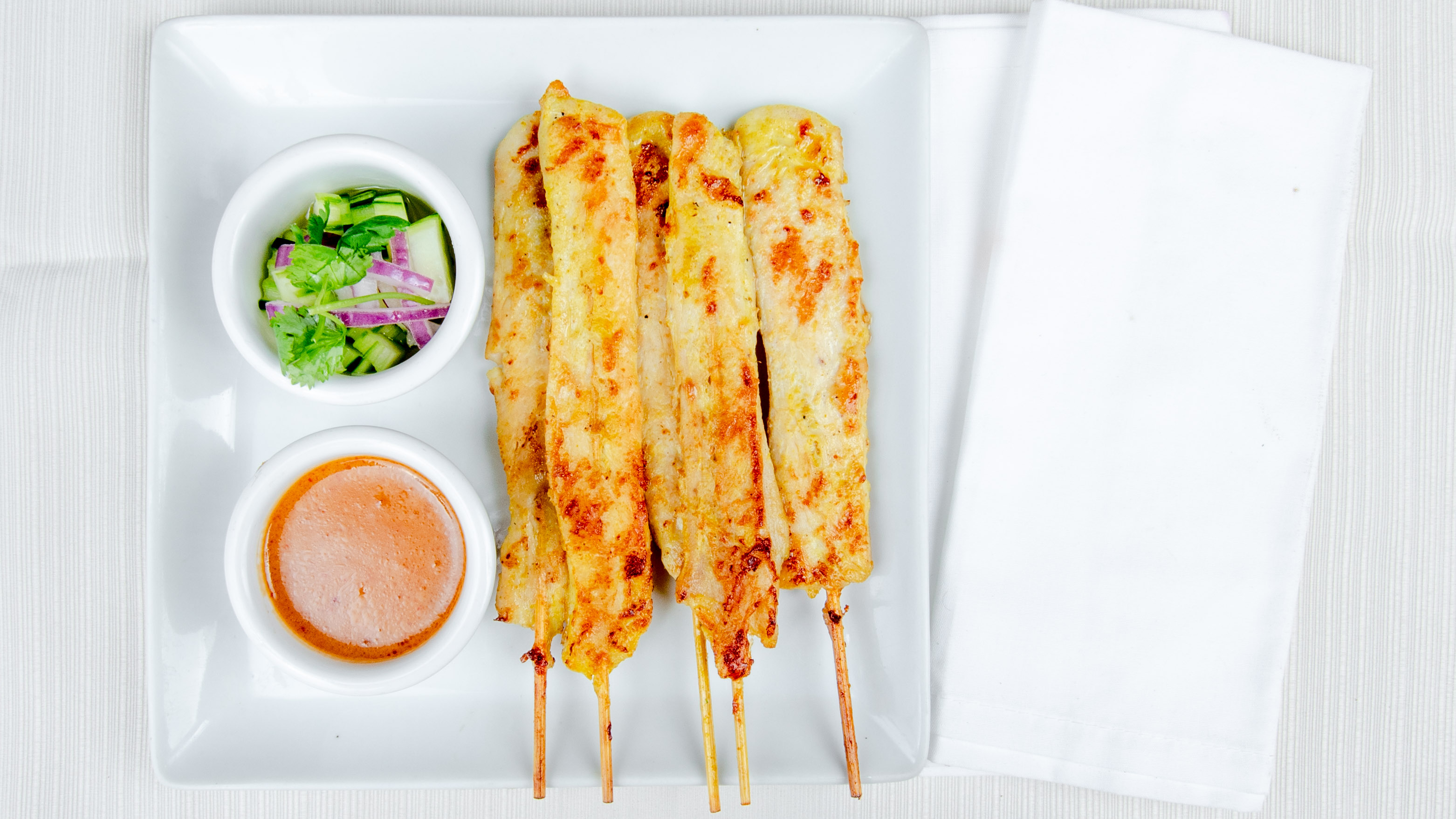 Order Chicken satay food online from Wanya Thai Restaurant store, Canyon Country on bringmethat.com