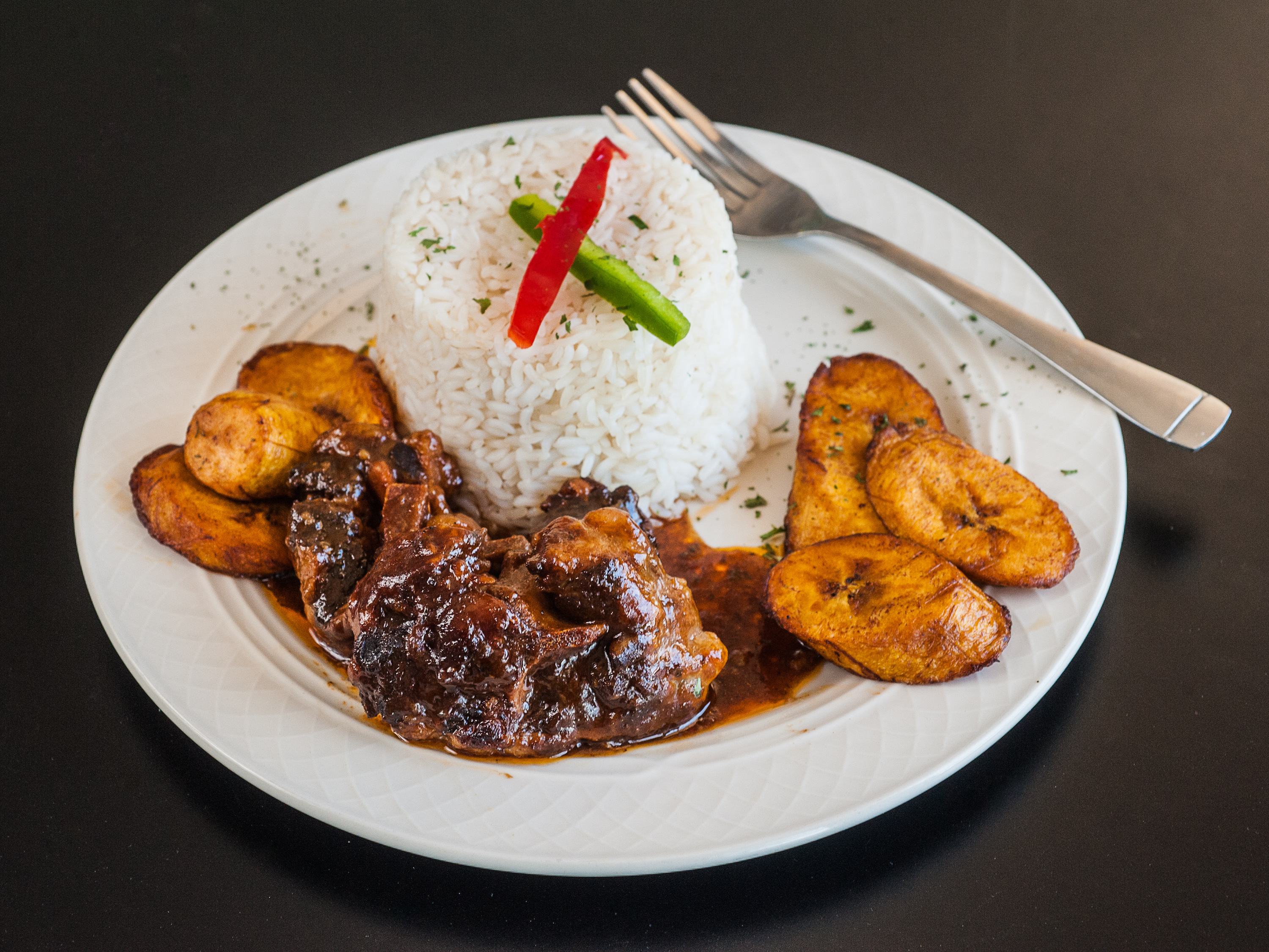 Order Oxtail White Rice and Plantains Dinner food online from Spice Bistro store, Atlanta on bringmethat.com