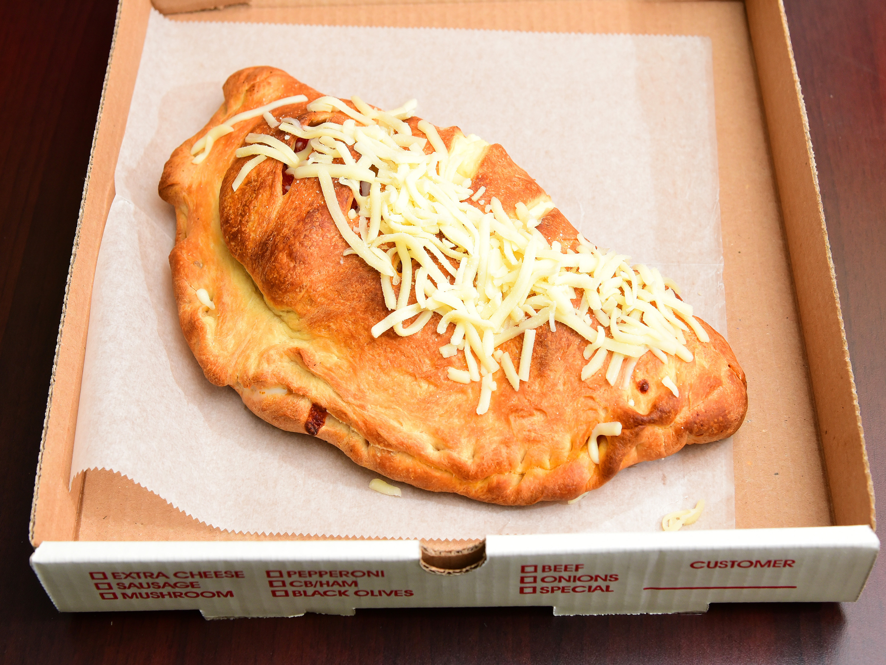 Order Calzone food online from Ithaca Pasta Bravo's store, Freeville on bringmethat.com