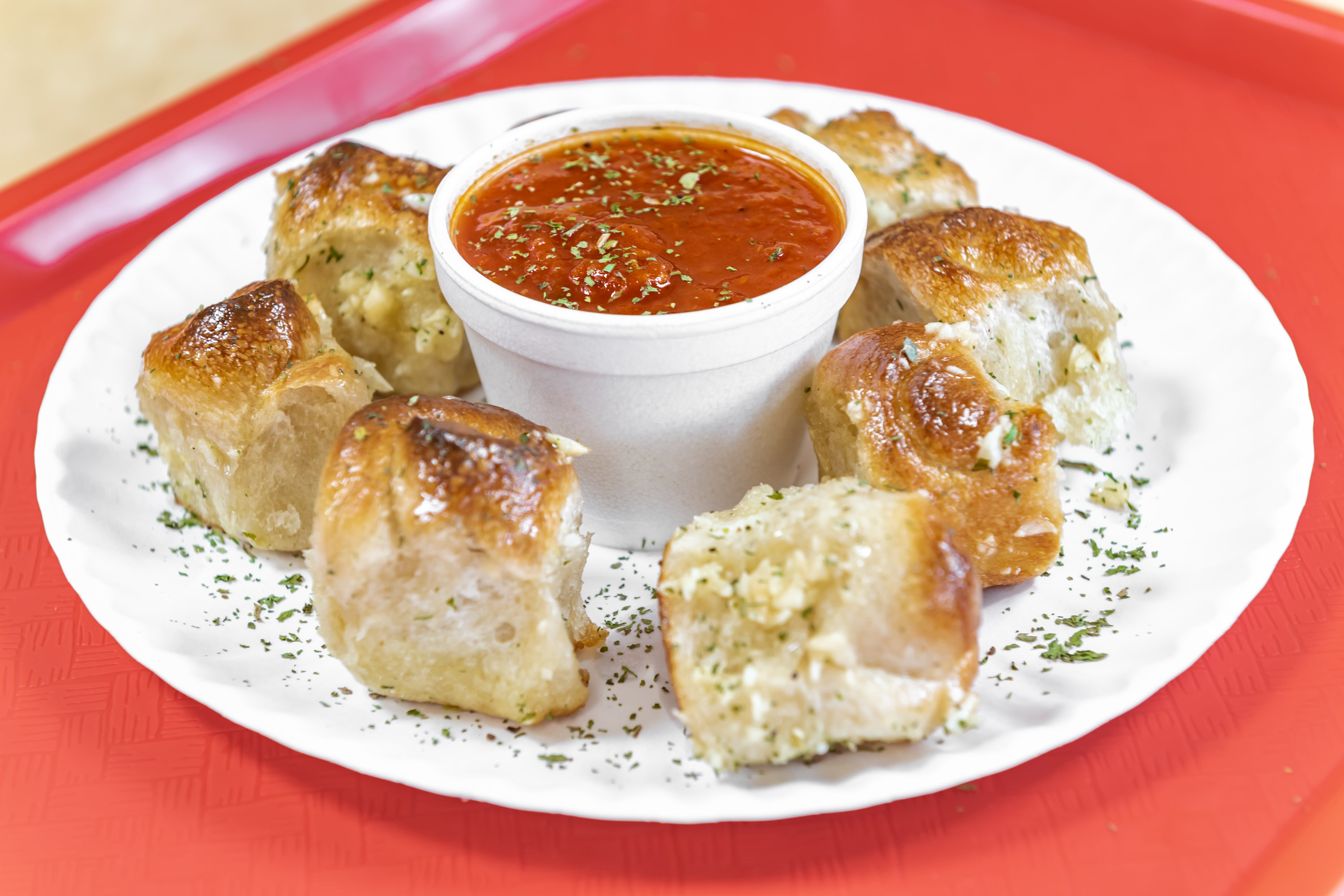Order Garlic Knots - 1 Piece food online from Bambino's Pizza & Pasta store, Danbury on bringmethat.com