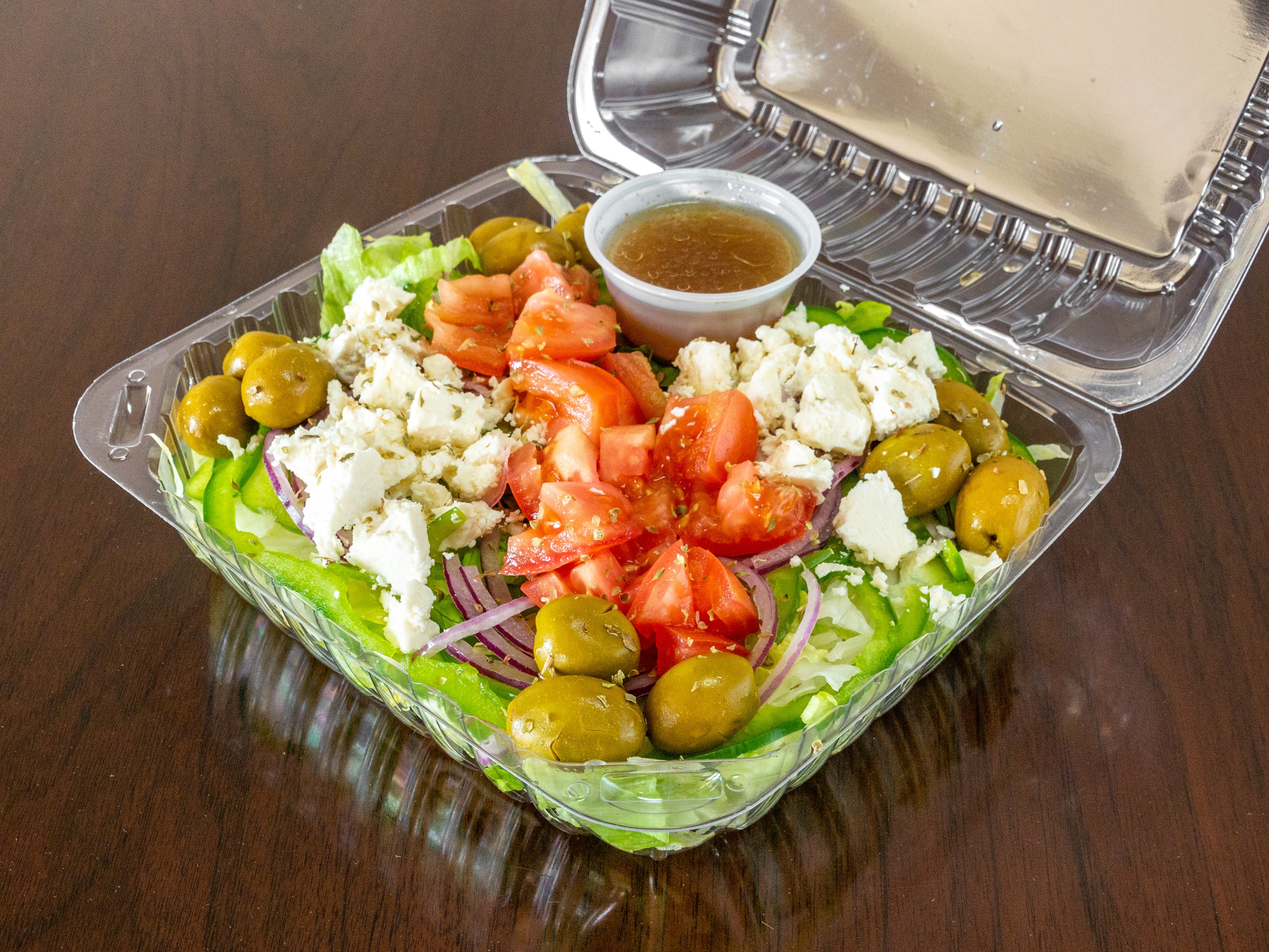 Order Greek Salad food online from Joe's Pizza and Subs store, Santa Cruz on bringmethat.com