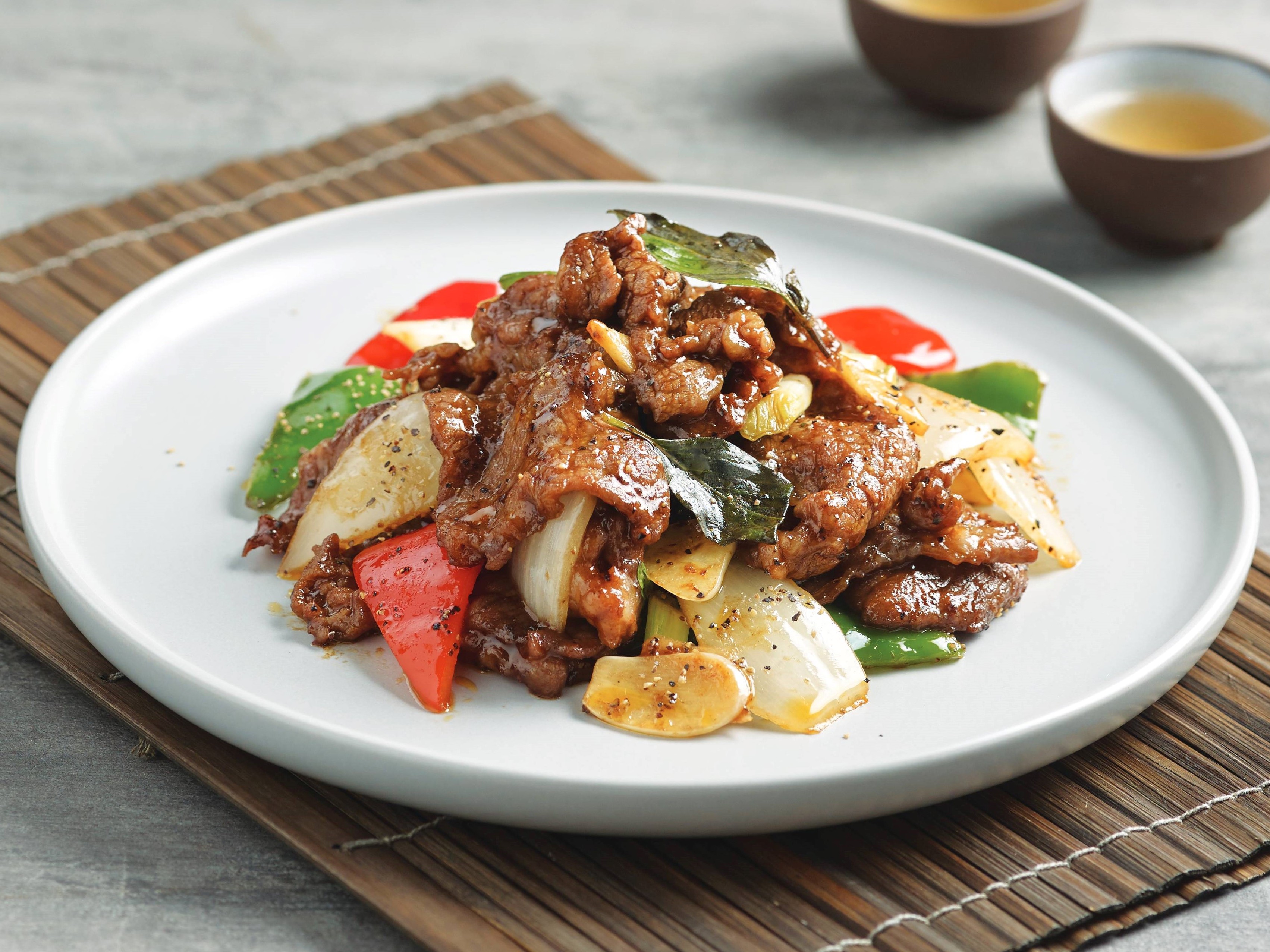 Order E1. Stir-Fried Black Pepper Angus beef with basil food online from Paradise Dynasty store, Costa Mesa on bringmethat.com