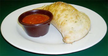 Order Calzone - Calzone food online from Primas Pasta & Pizza Restaurant store, Fort Worth on bringmethat.com