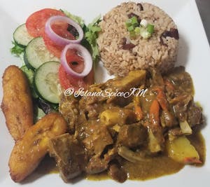 Order Curried Goat food online from Island Spice Jamaican Restaurant store, Leavenworth on bringmethat.com