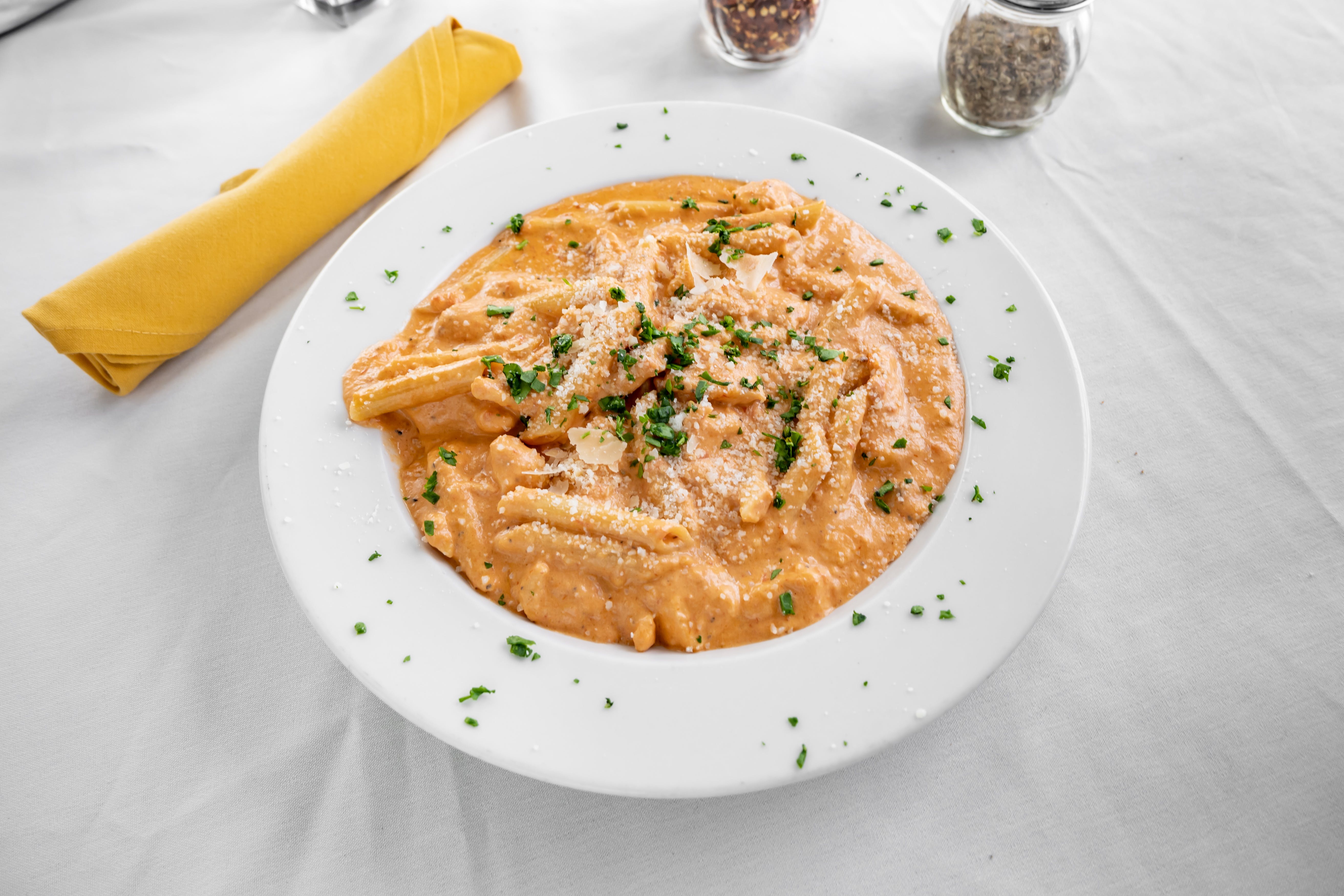Order Vodka Pink Sauce Pasta with Chicken - Pasta food online from Mama's Pizza Grille & Bistro store, Mt Laurel on bringmethat.com