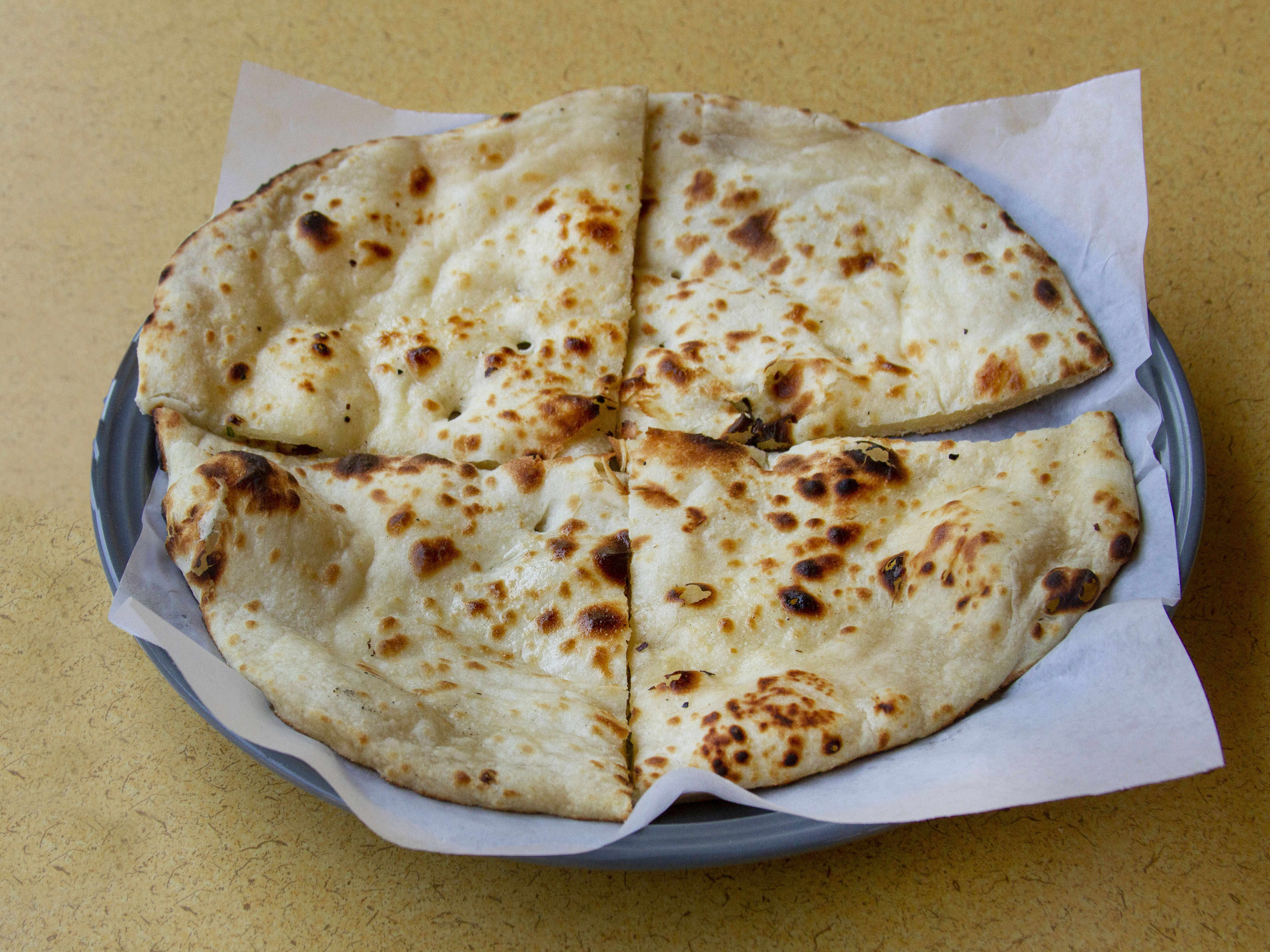 Order Garlic Naan food online from Samosa Hut And Spices store, Fresno on bringmethat.com