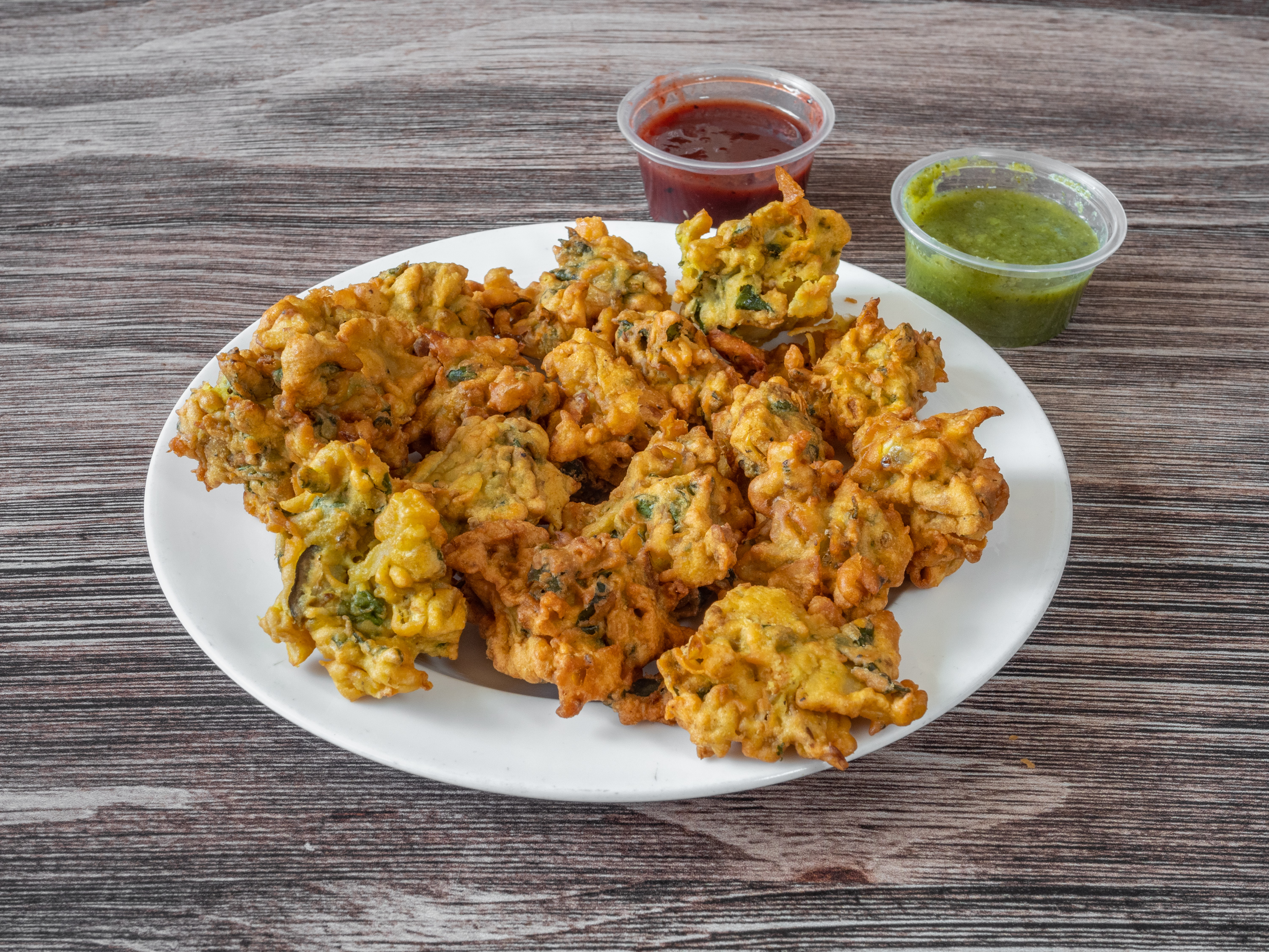 Order Vegetarian Pakora food online from Golden Gate Pizza & Indian Cuisine store, San Francisco on bringmethat.com