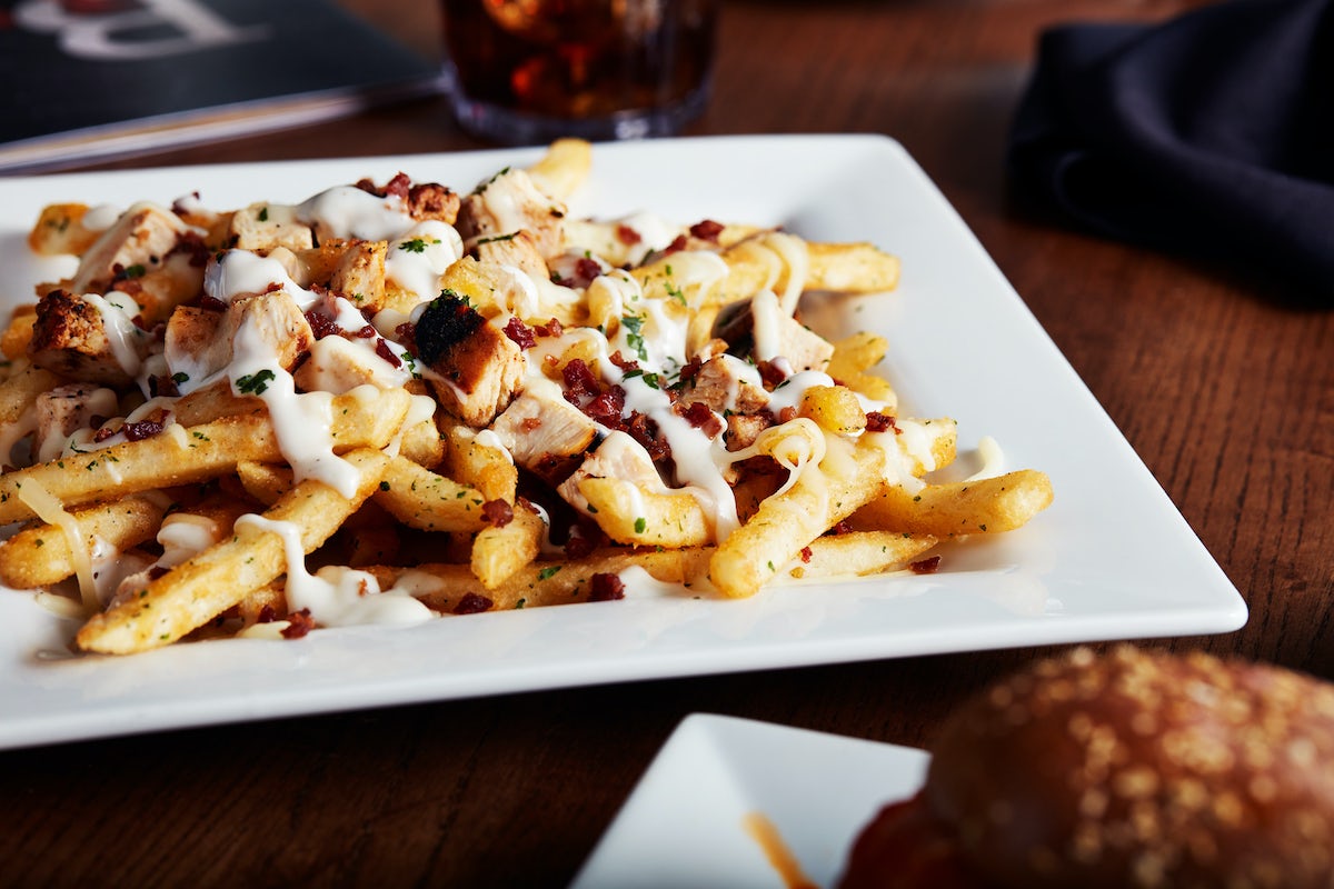 Order CHICKEN BACON RANCH FRIES food online from Big Whiskey's American Restaurant & Bar store, Ozark on bringmethat.com