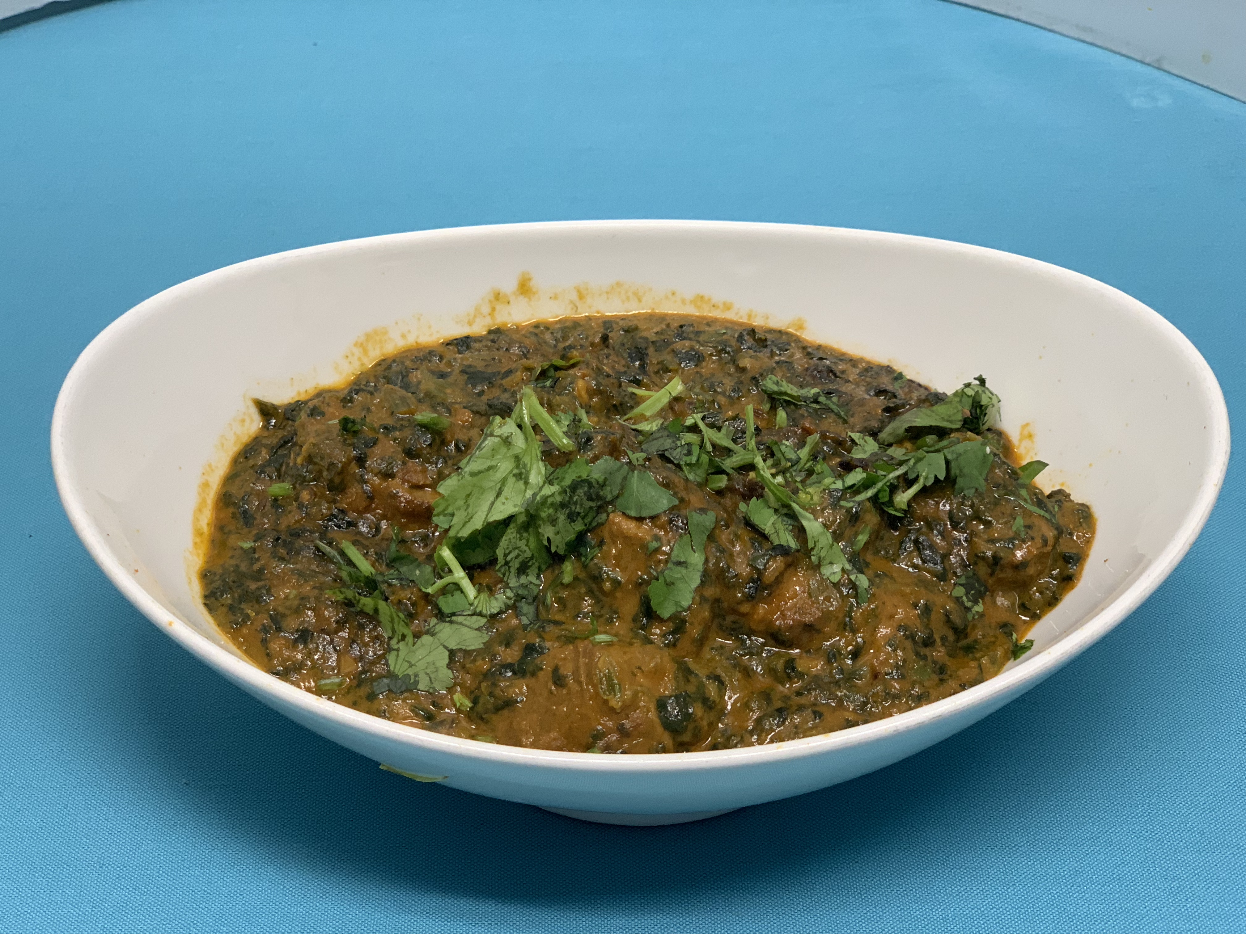 Order Lamb Saag food online from Aahar Indian Cuisine store, New York on bringmethat.com
