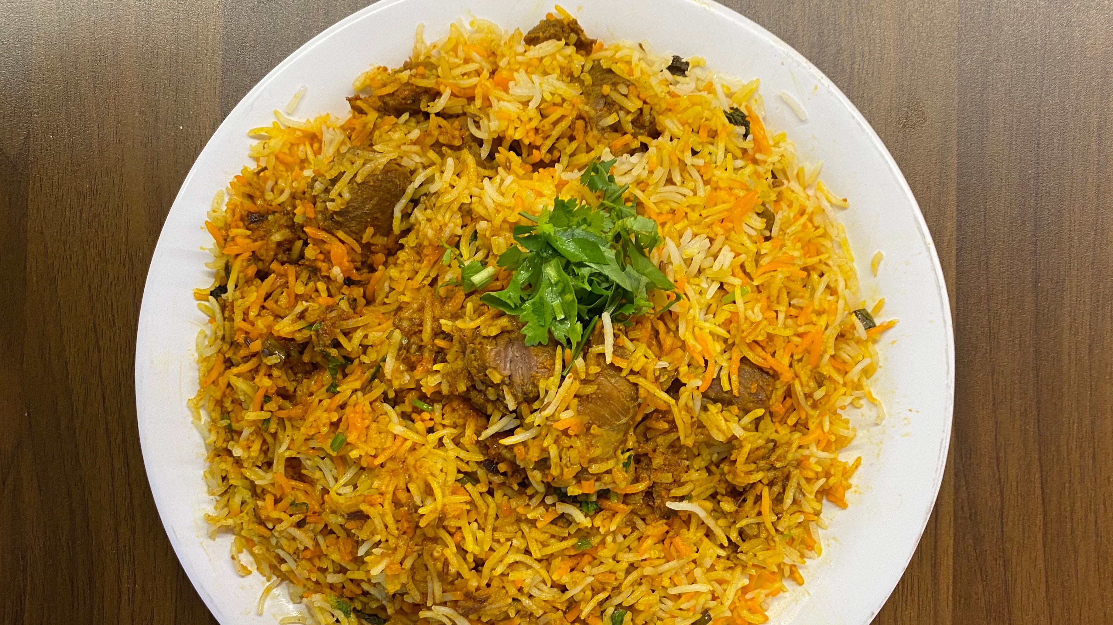 Order Goat Biryani food online from Indian Cafe store, East Moline on bringmethat.com