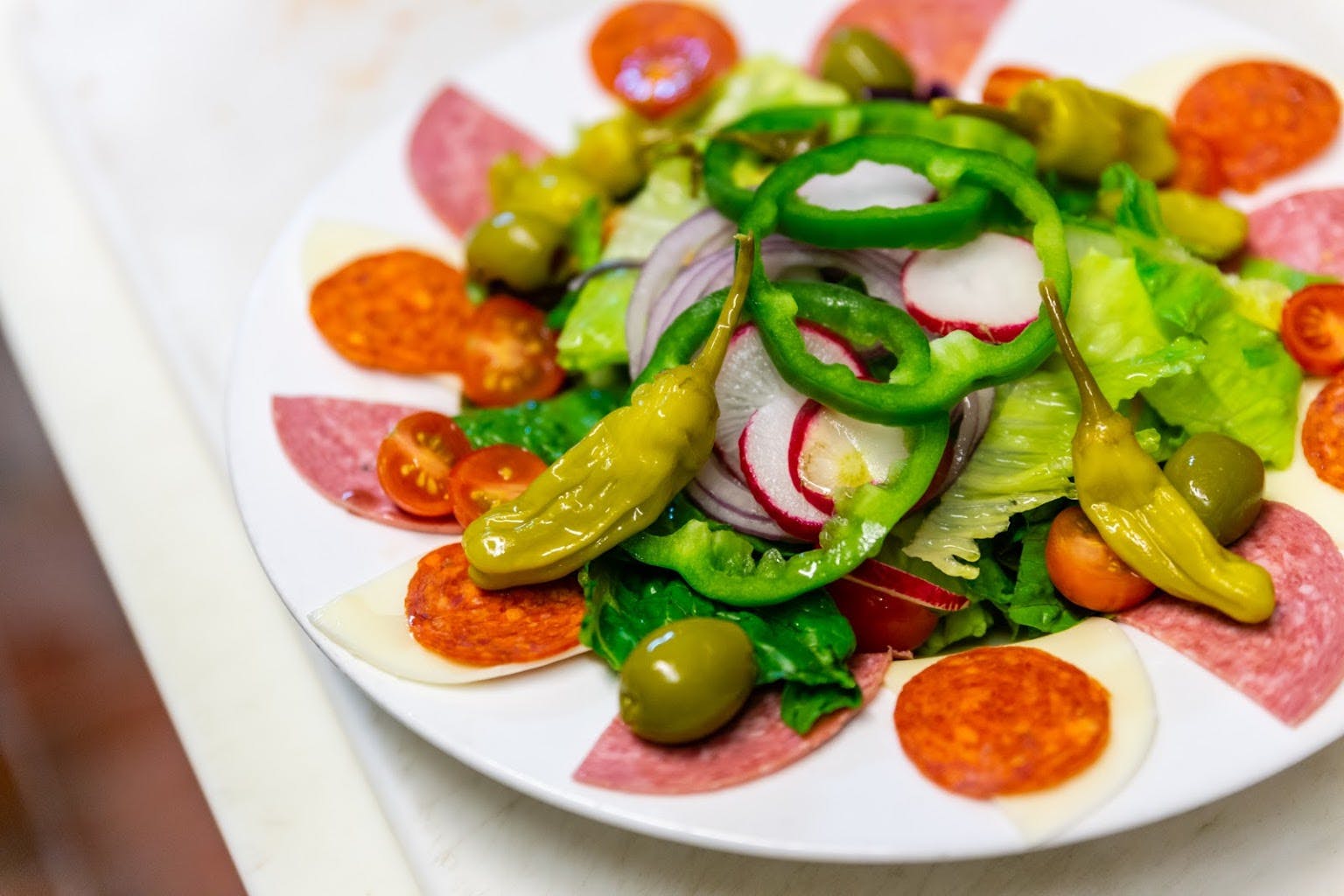 Order Antipasto Salad - Salad food online from Michael's Italian Restaurant store, Waukesha on bringmethat.com